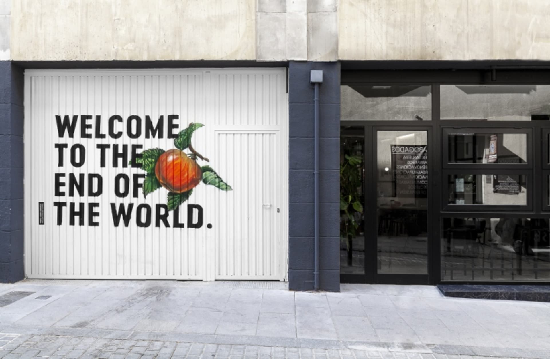 A minimalist street view featuring concrete and glass materials