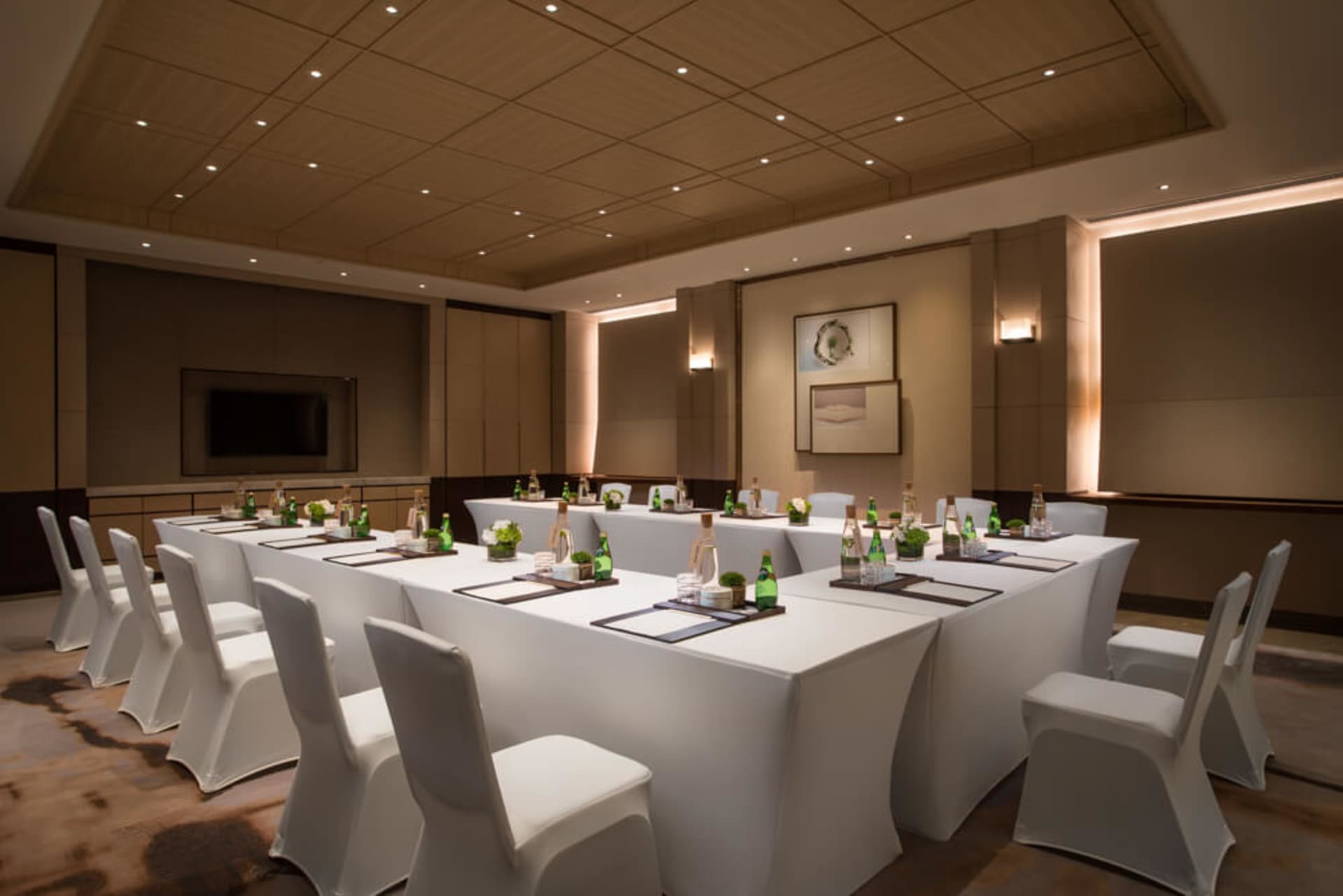 Industrial-style conference room with fabric-covered seating