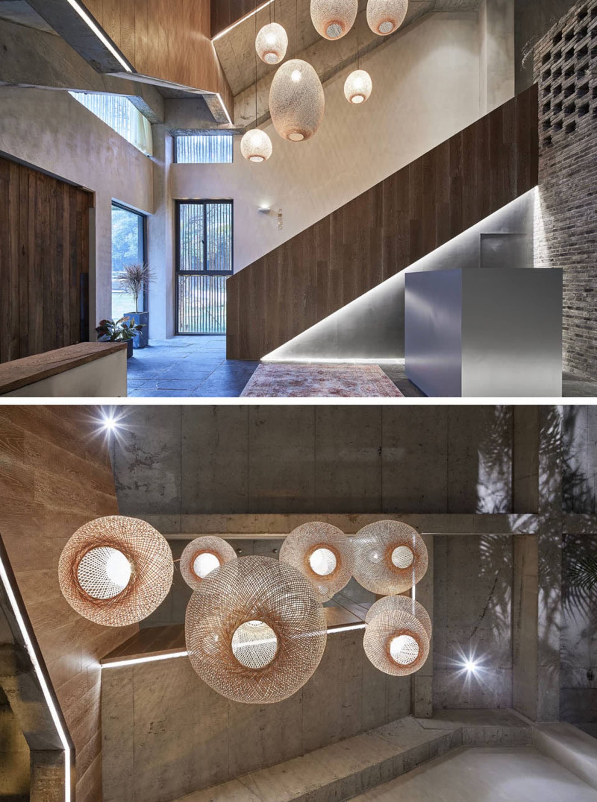 A modern hallway with concrete walls, wooden accents, and large woven pendant lights hanging from the ceiling.