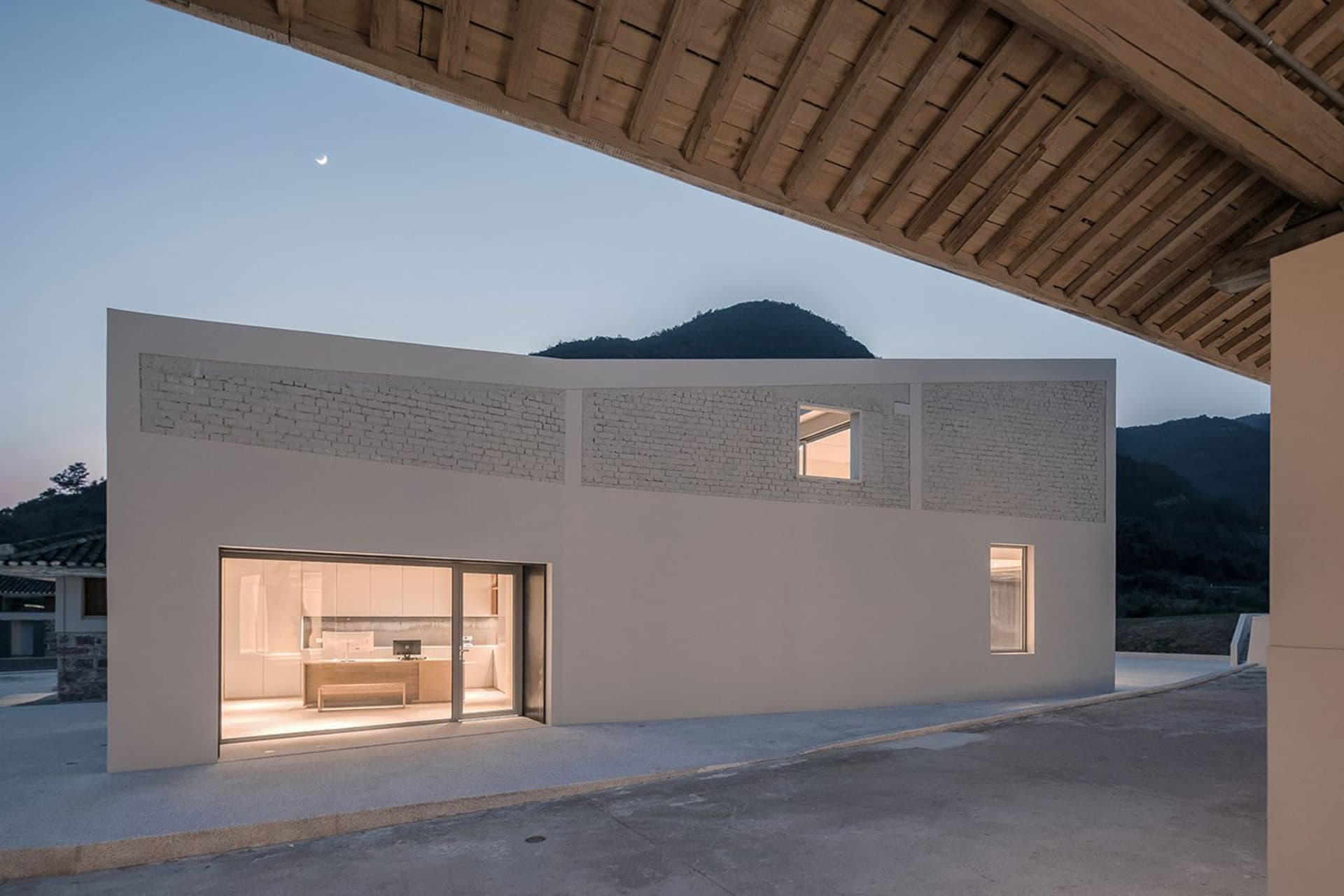 Modern residential space featuring concrete and glass materials.