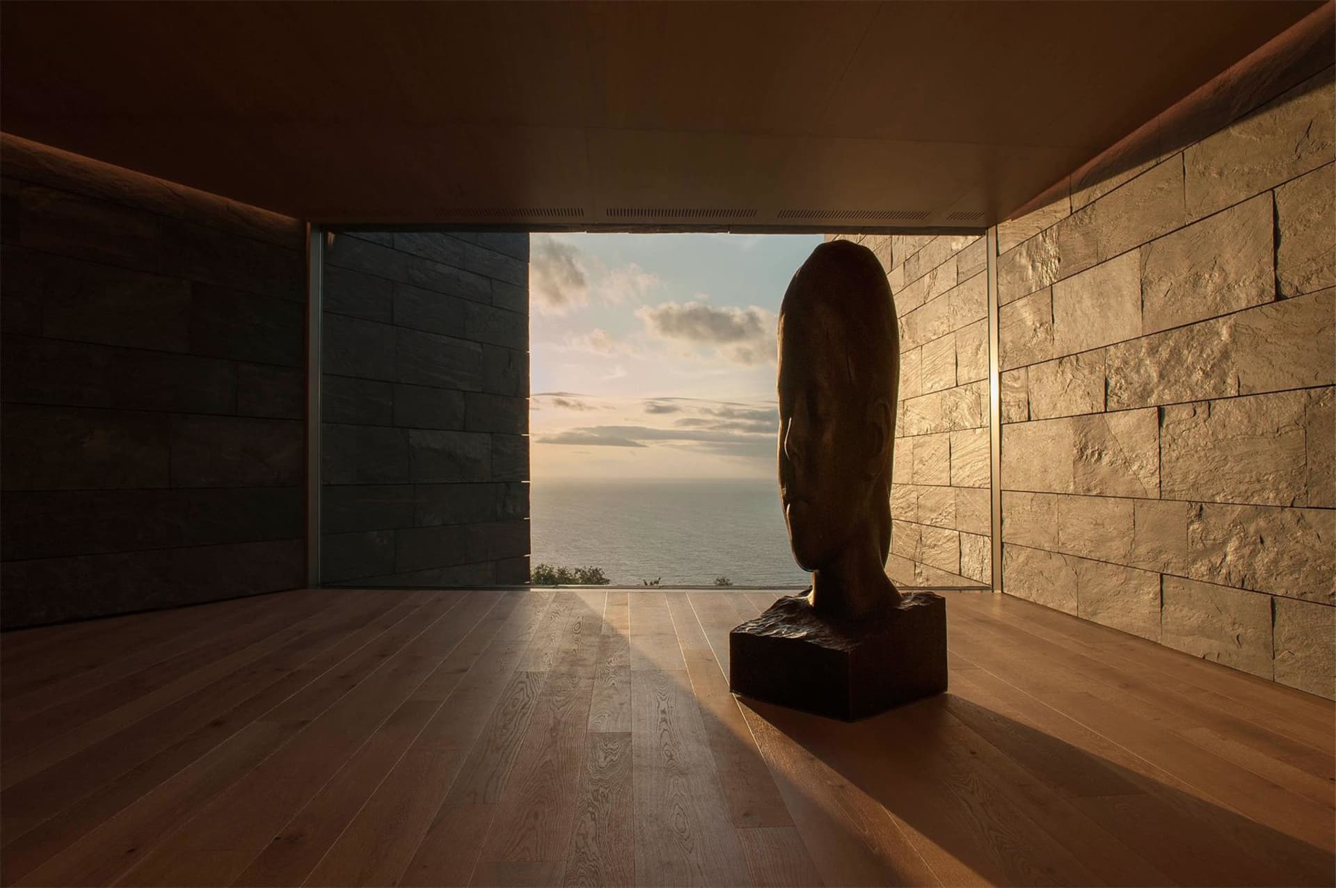 Stone minimalist interior space with ocean view