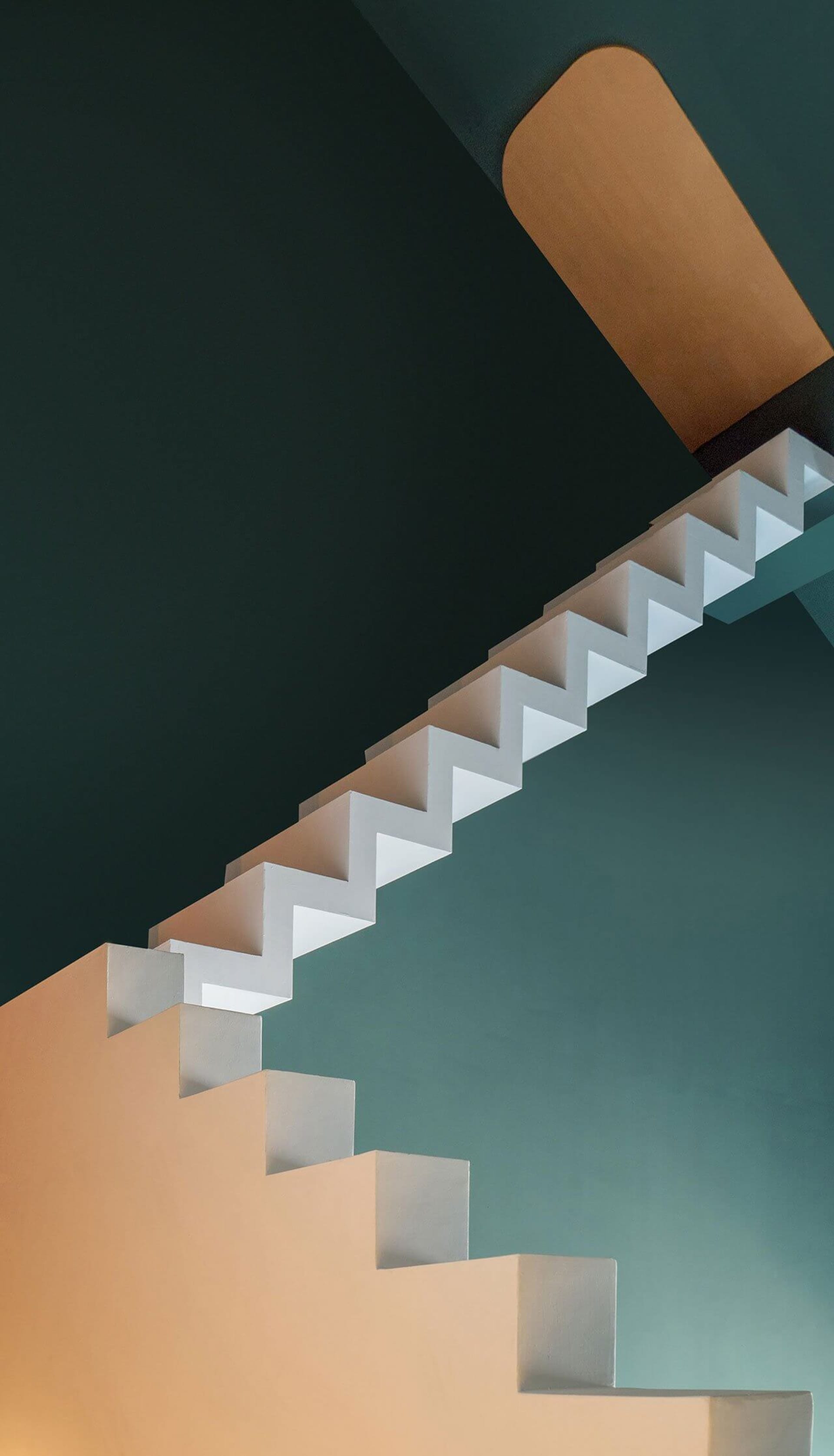 Staircase with white painted steps against a dark green painted wall