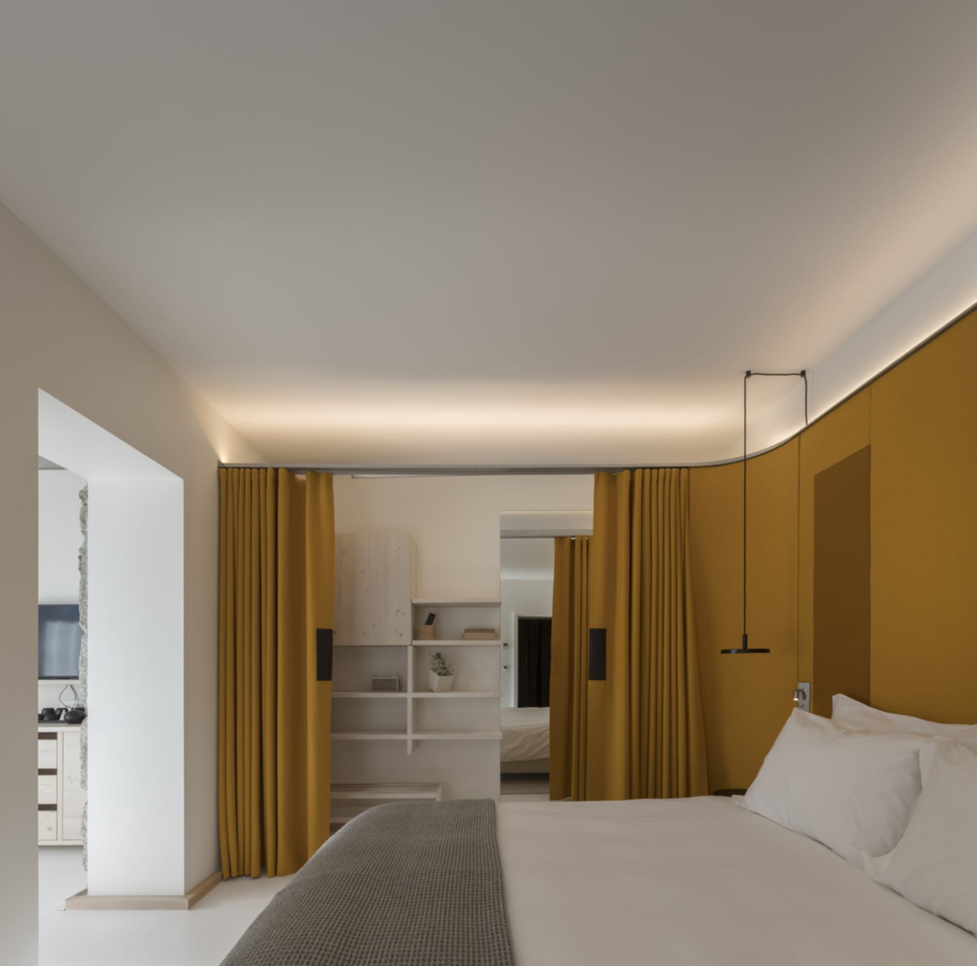 Modern minimalist bedroom featuring yellow curtains