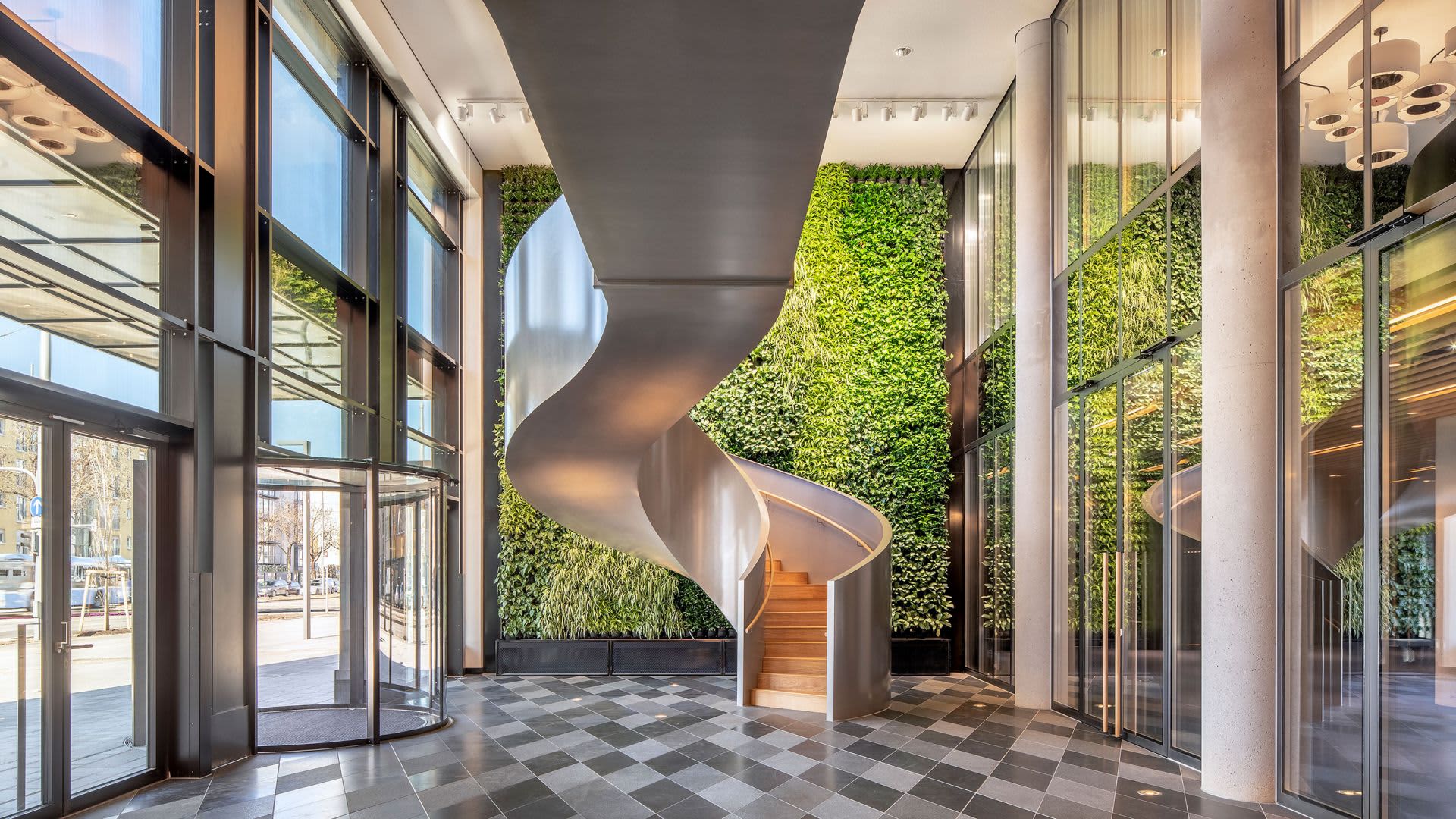 Modern office lobby with concrete, glass, and aluminum materials