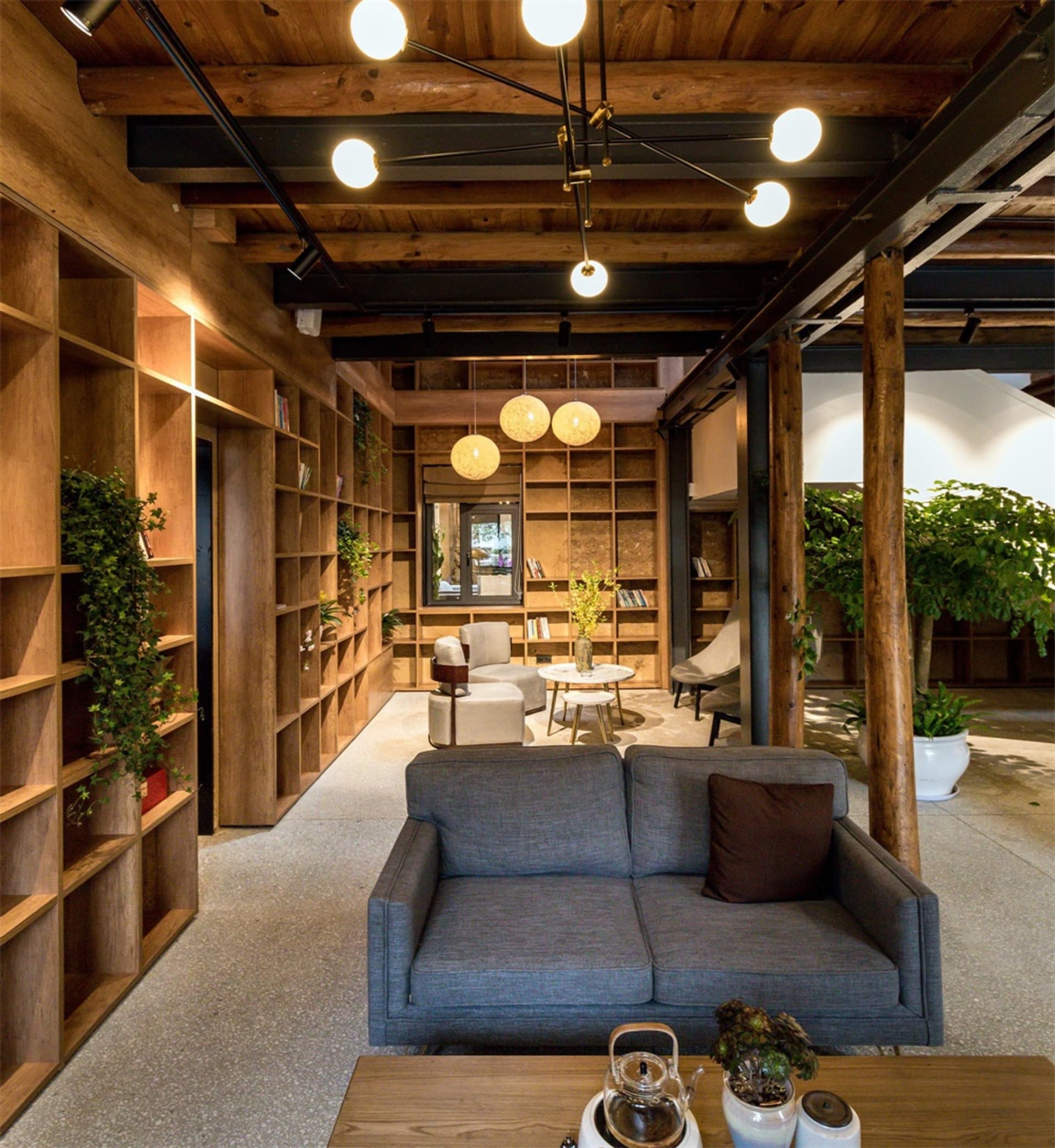 An industrial-style living room featuring wooden materials and a comfortable seating area.