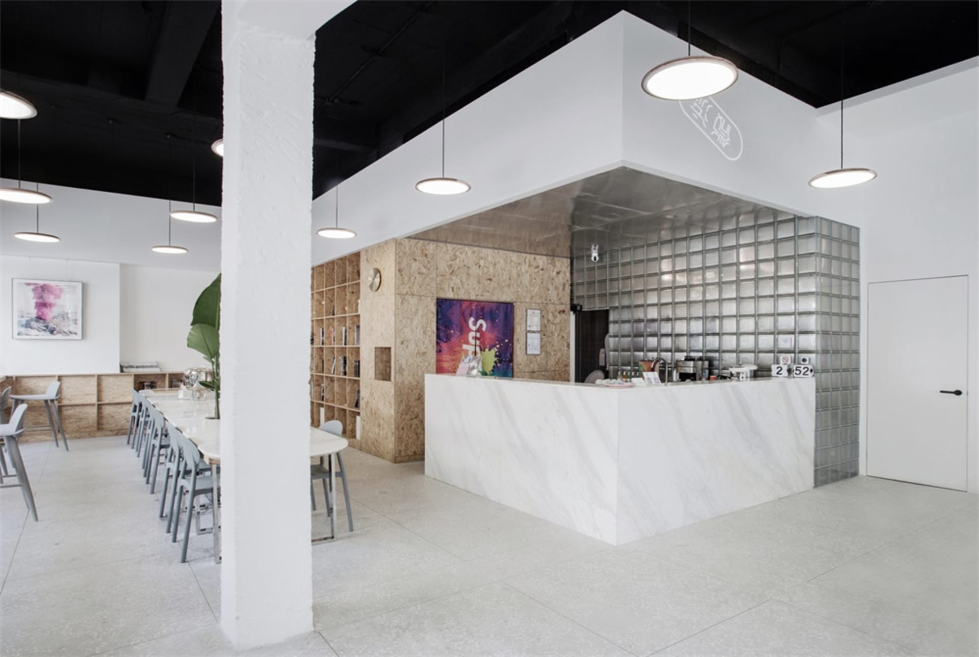 Modern cafe with marble ceiling and glass walls