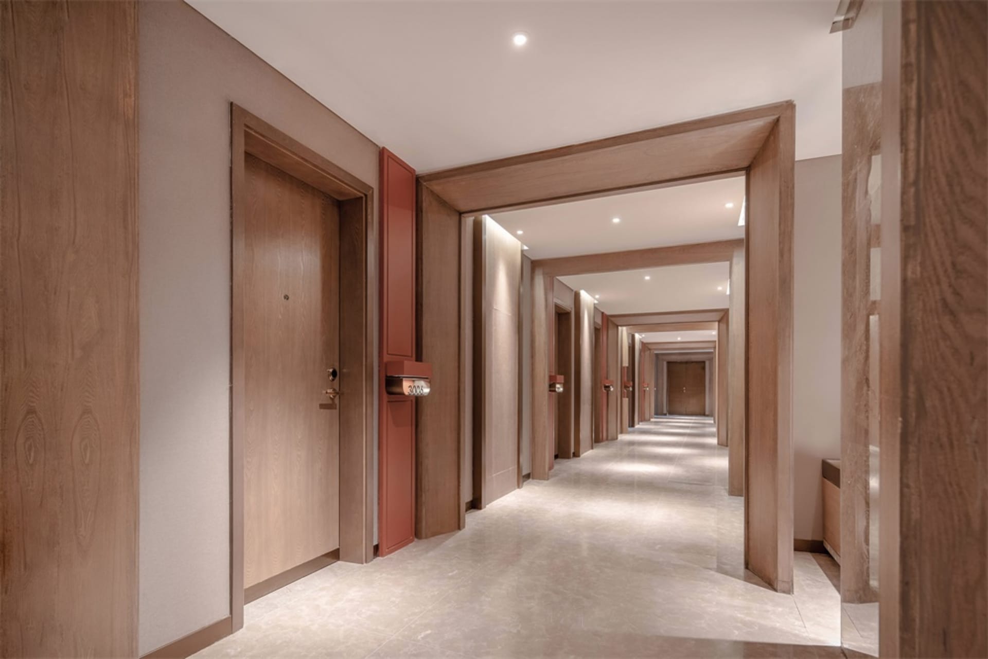 A modern hallway interior with wooden paneling and marble flooring.
