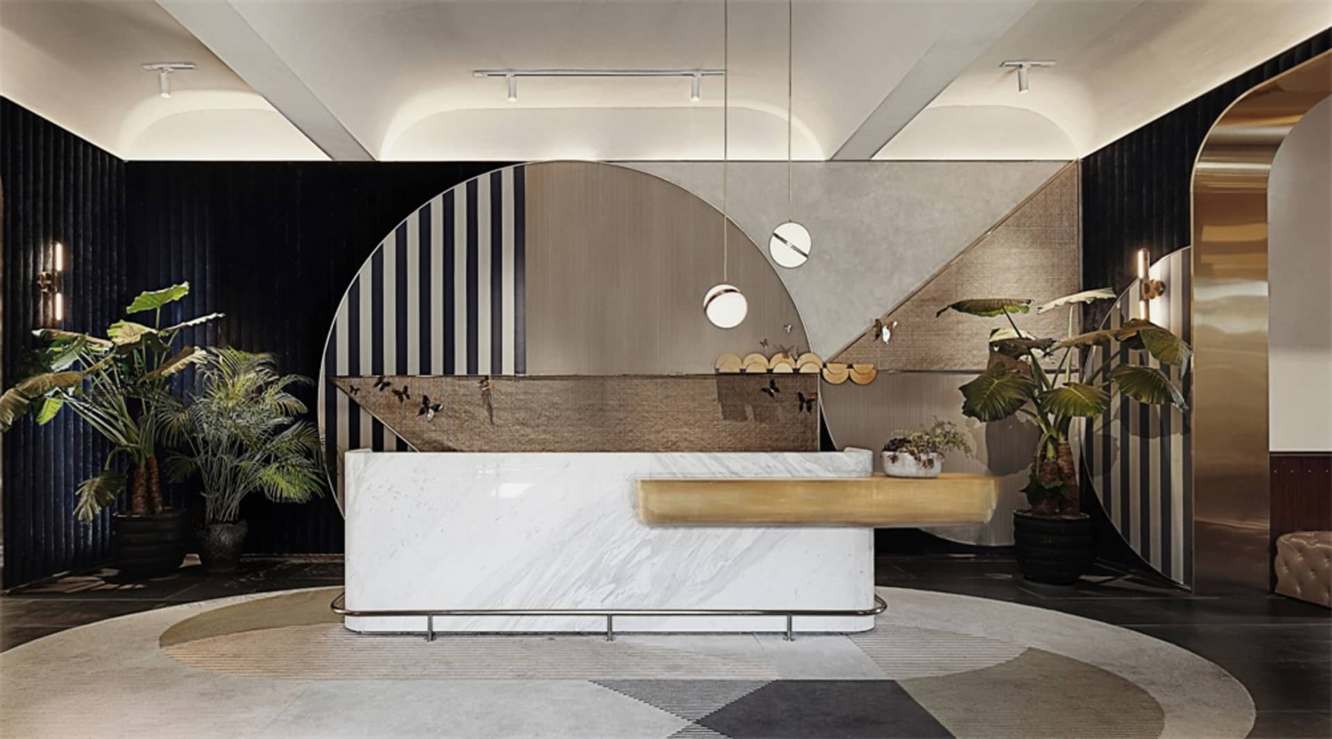A modern reception desk made of marble, metal, and wood