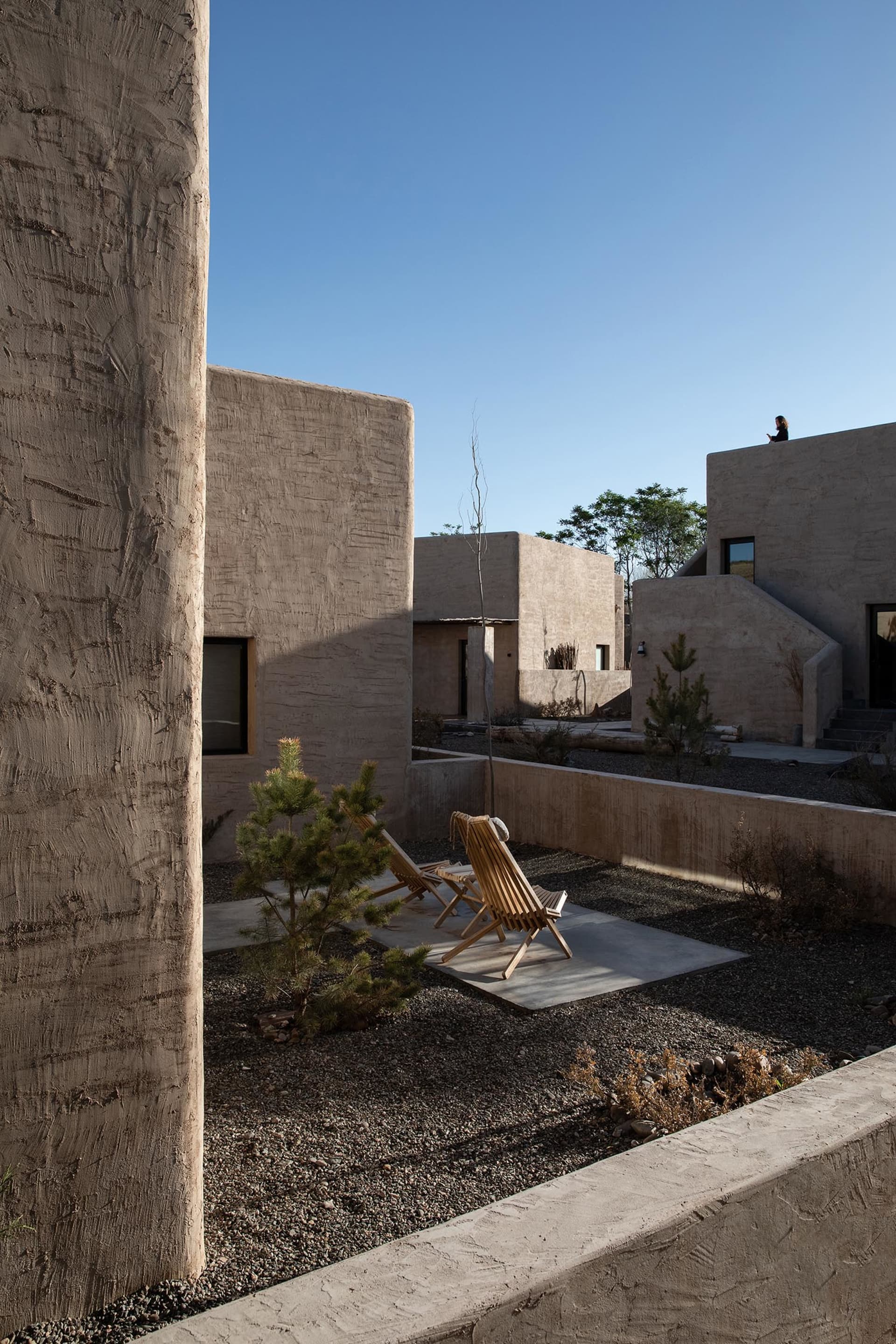A residential space featuring contemporary concrete architecture and minimalist design.
