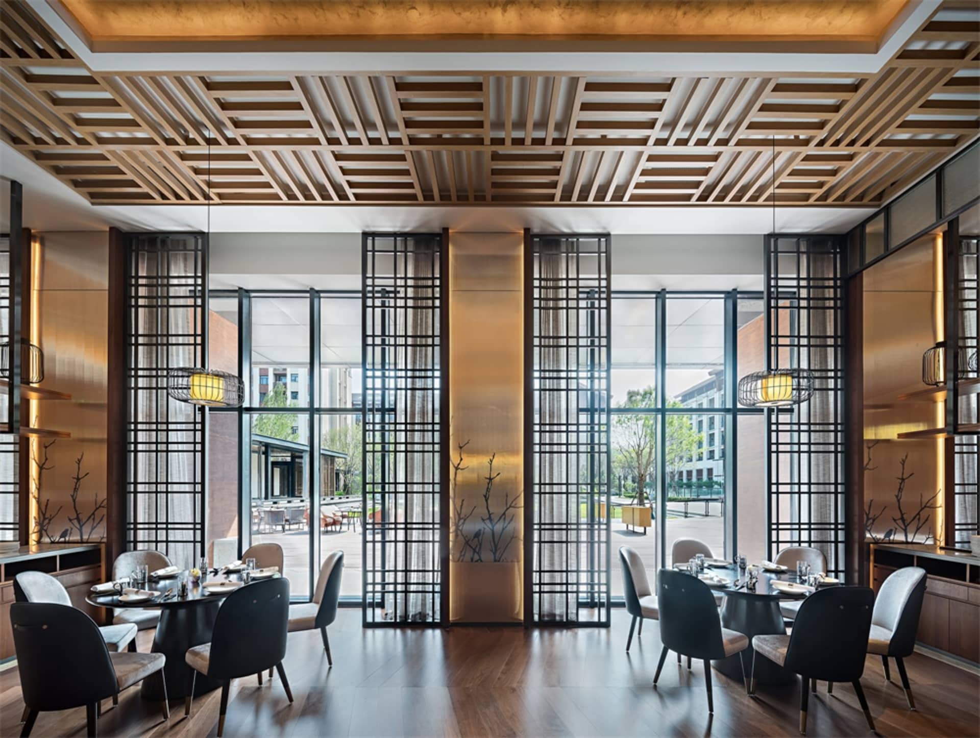 A modern restaurant interior featuring wood and glass materials.