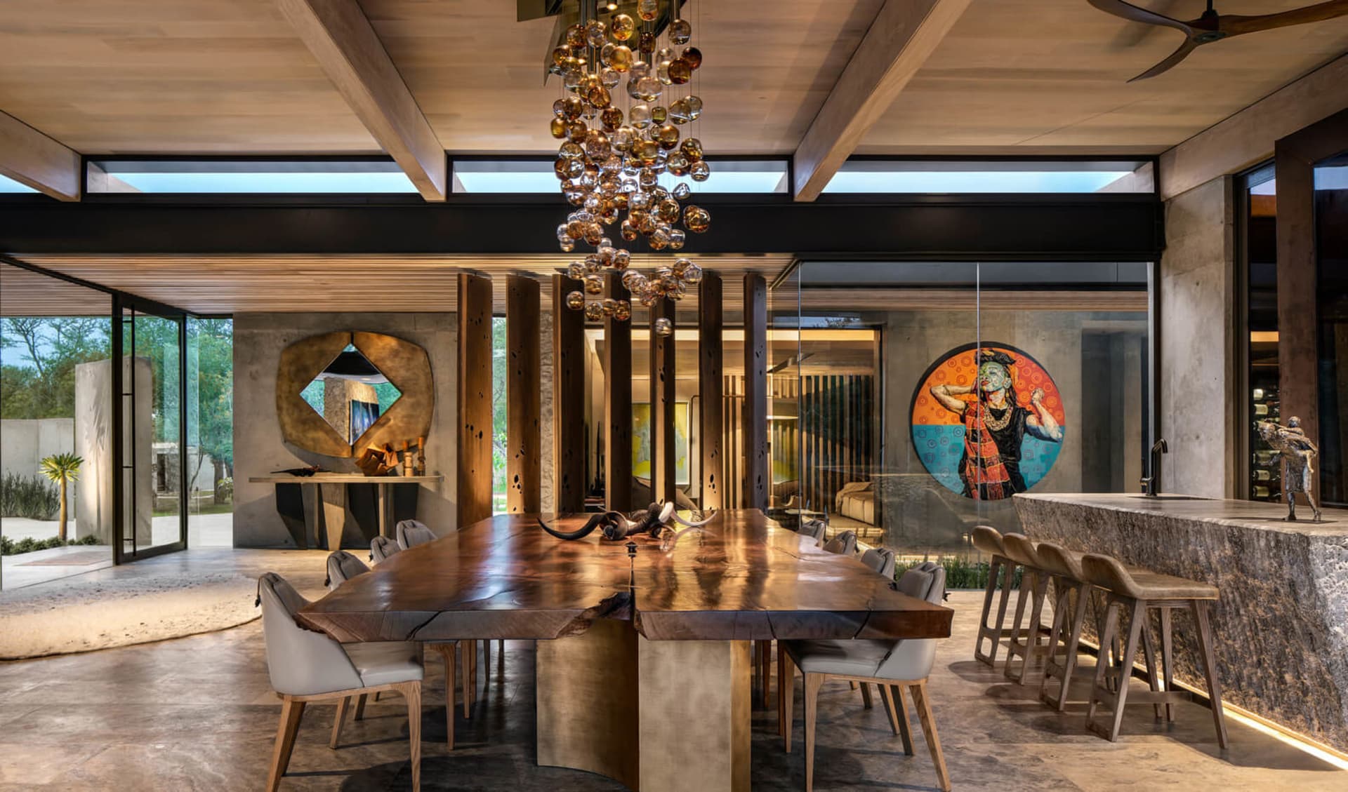 Modern dining room featuring wood and concrete elements.