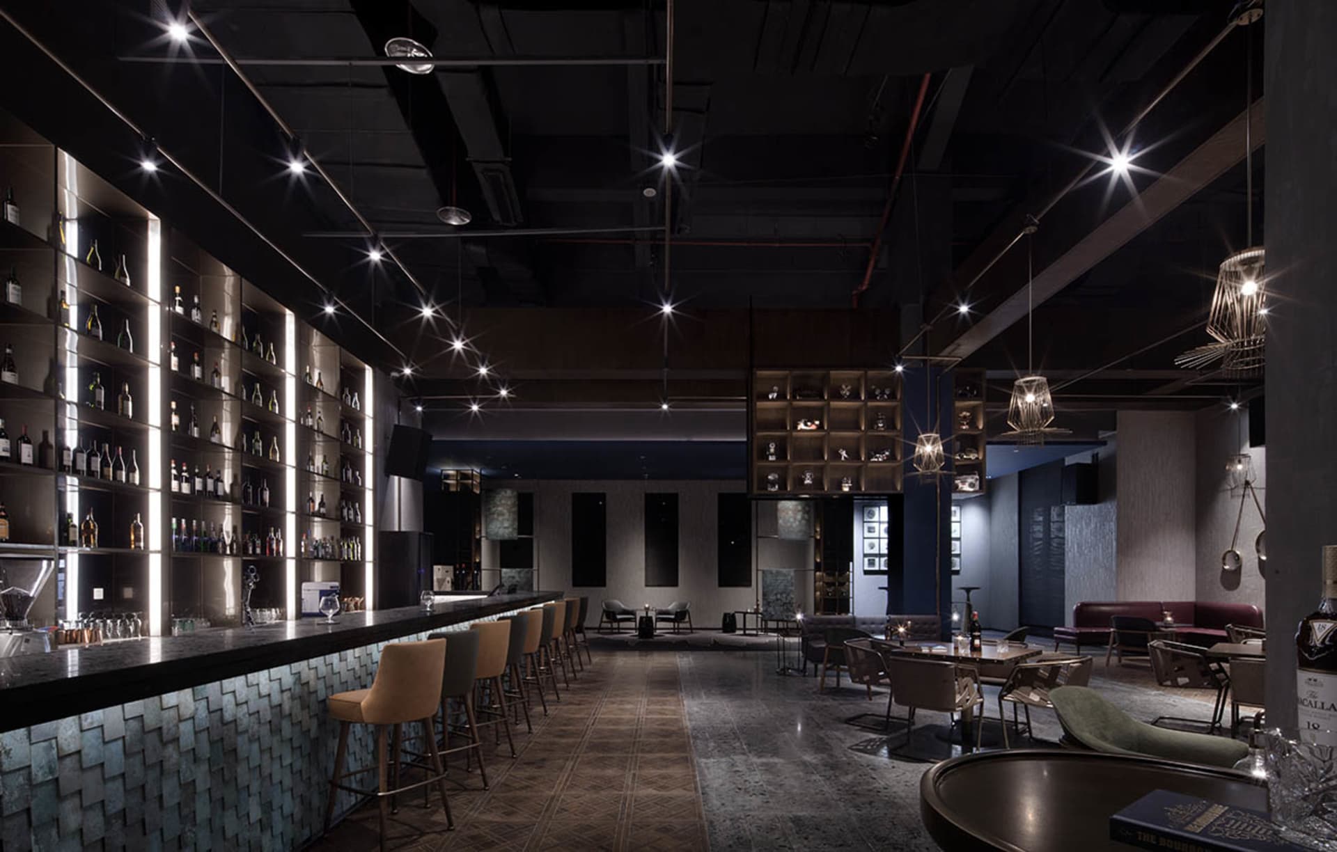A modern bar featuring metallic elements and sleek design.