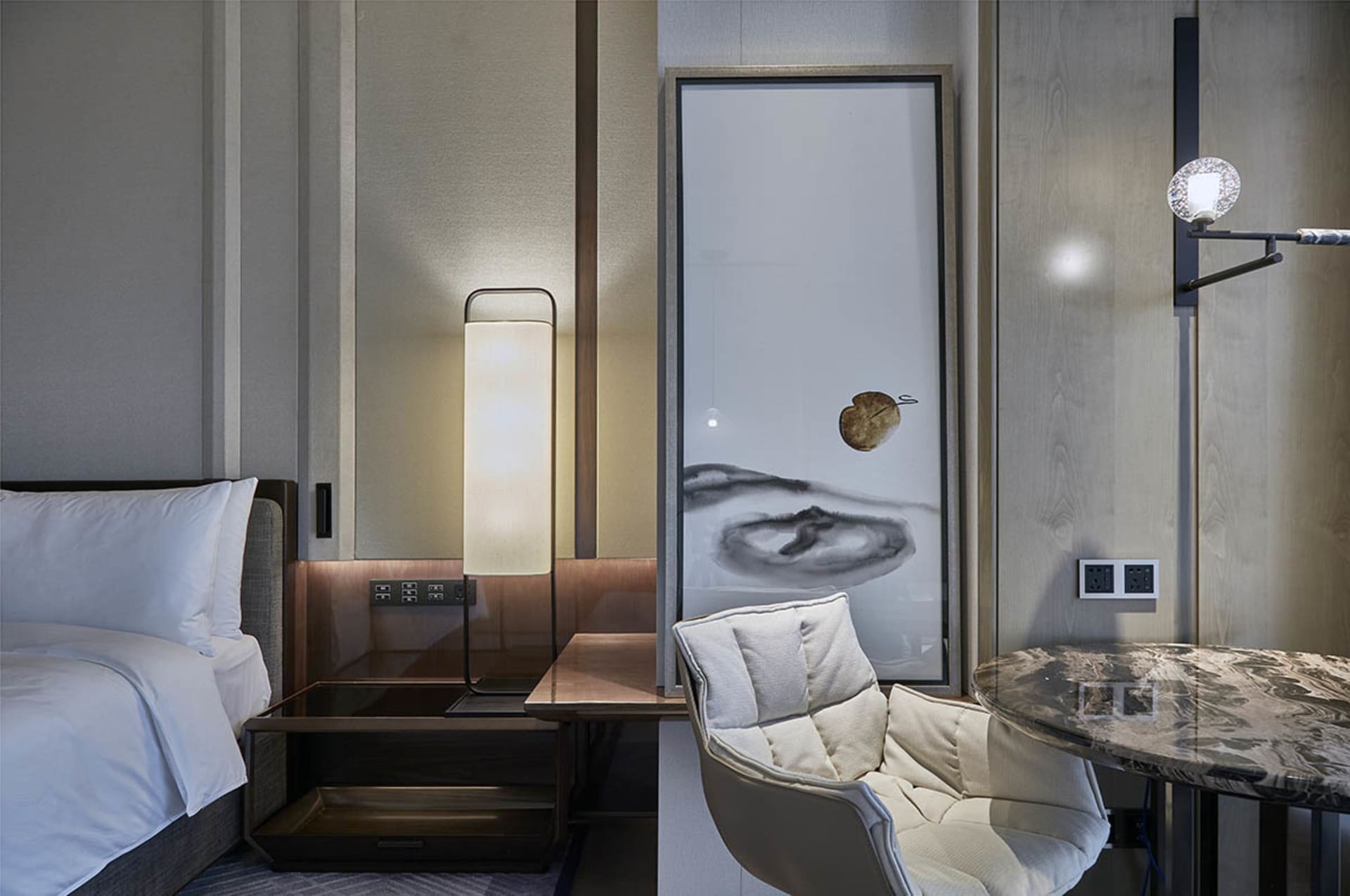 Modern minimalist bedroom featuring a bed with white linens and a wooden headboard, complemented by a minimalist white floor