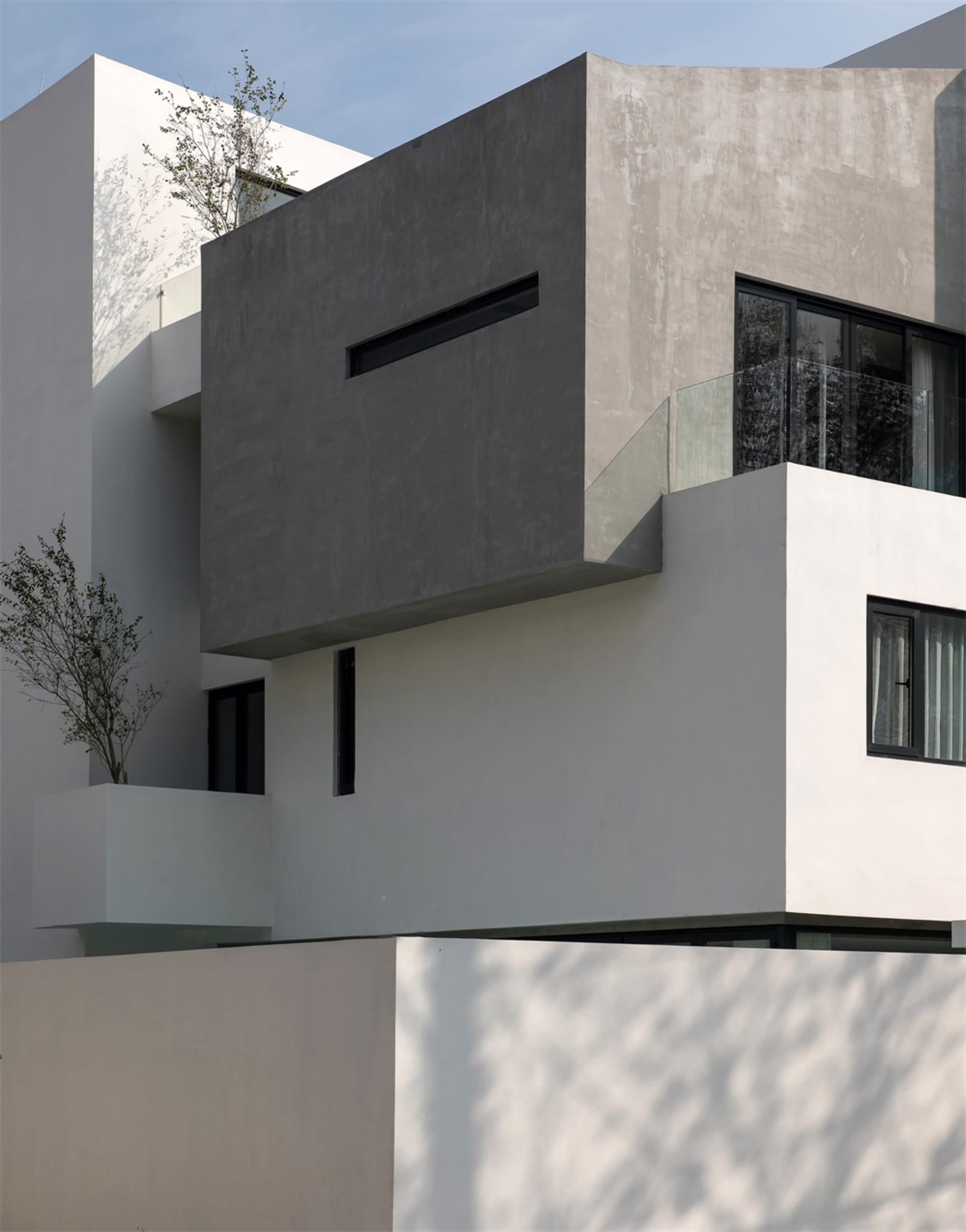 Modern building with concrete exterior and minimalist design.