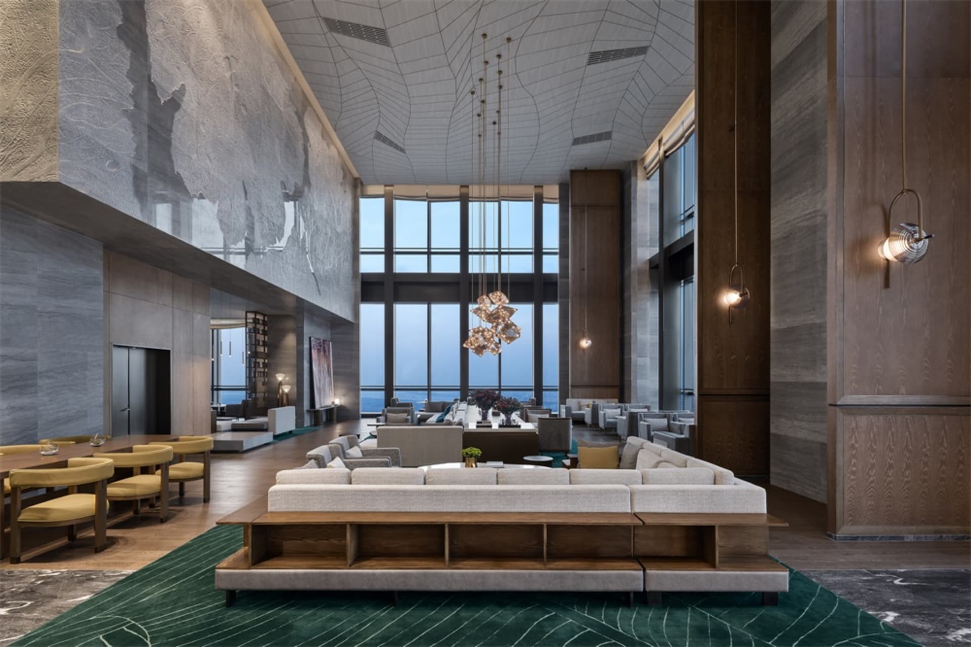 現代飯店大廳融合多種材質與設計元素,搭配大型沙發、水晶燈與地板