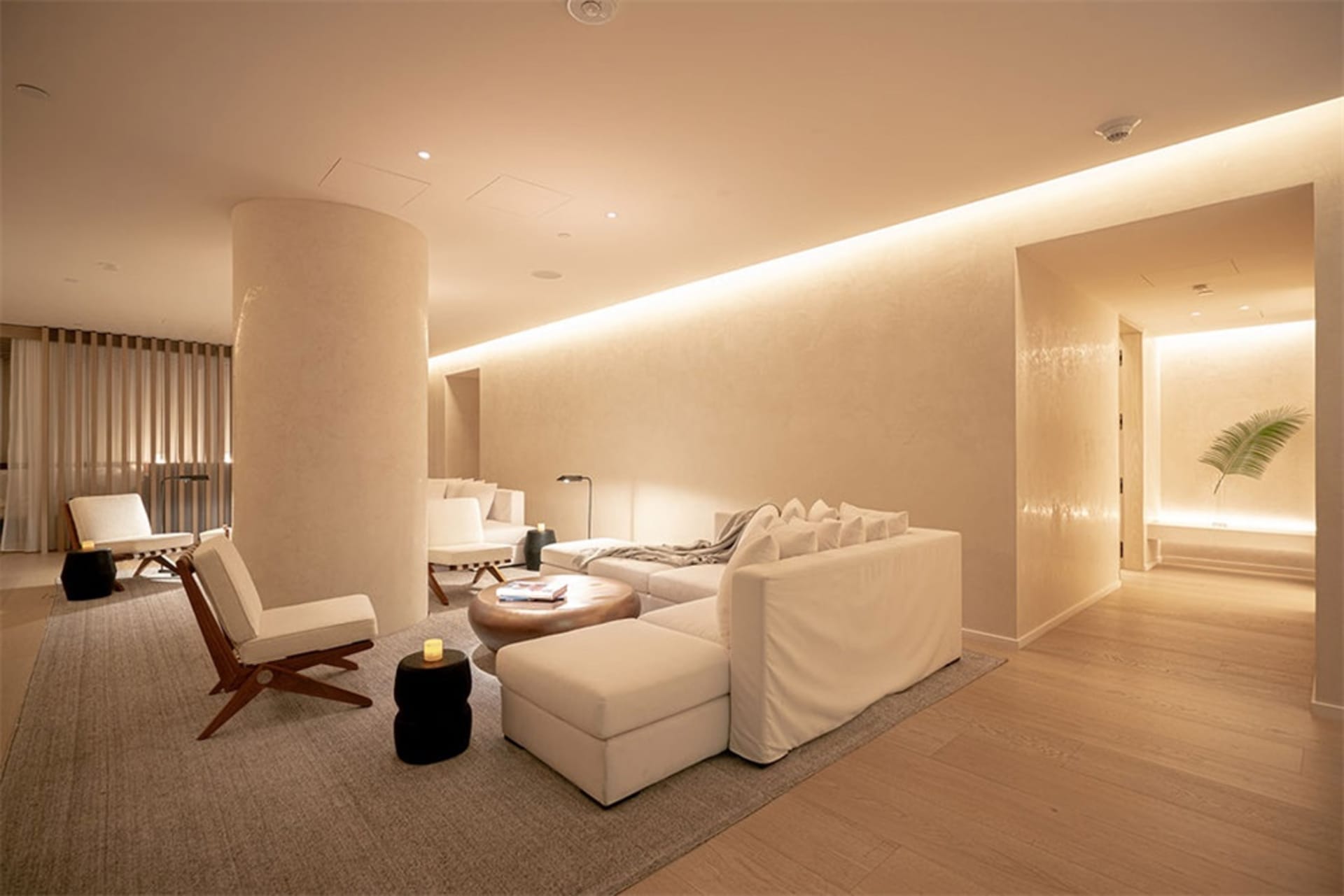 A modern minimalist living room with neutral-tone materials and a serene atmosphere.