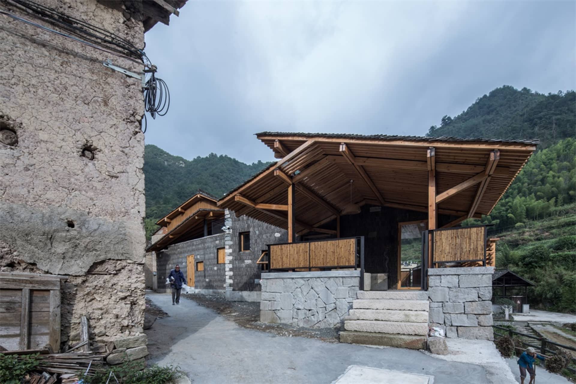 Traditional village architecture featuring stone and clay with wooden roofing