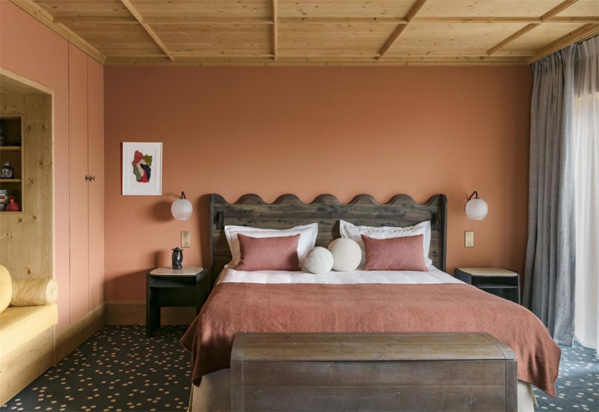 Bedroom featuring a wooden bed with pink bedding and wall art.