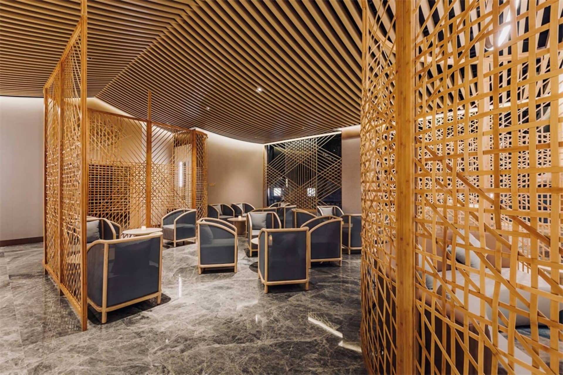 A modern interior lobby featuring wood elements and contemporary furniture.