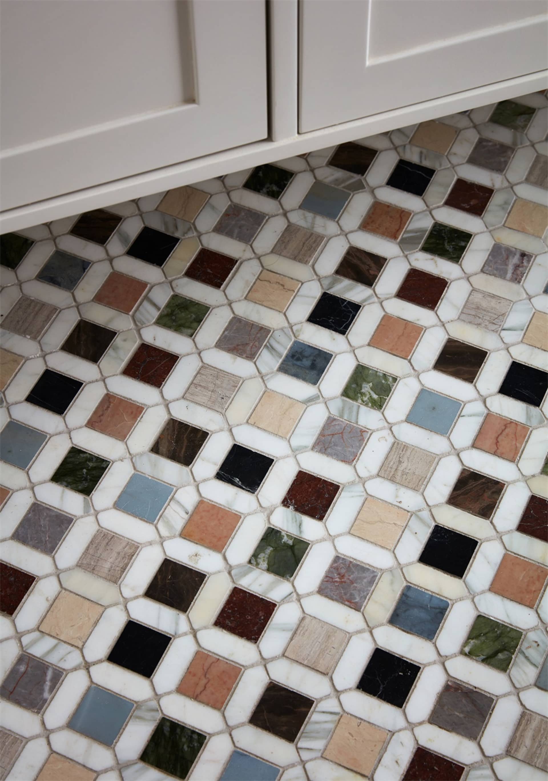 A patterned mosaic floor made of various marble tiles