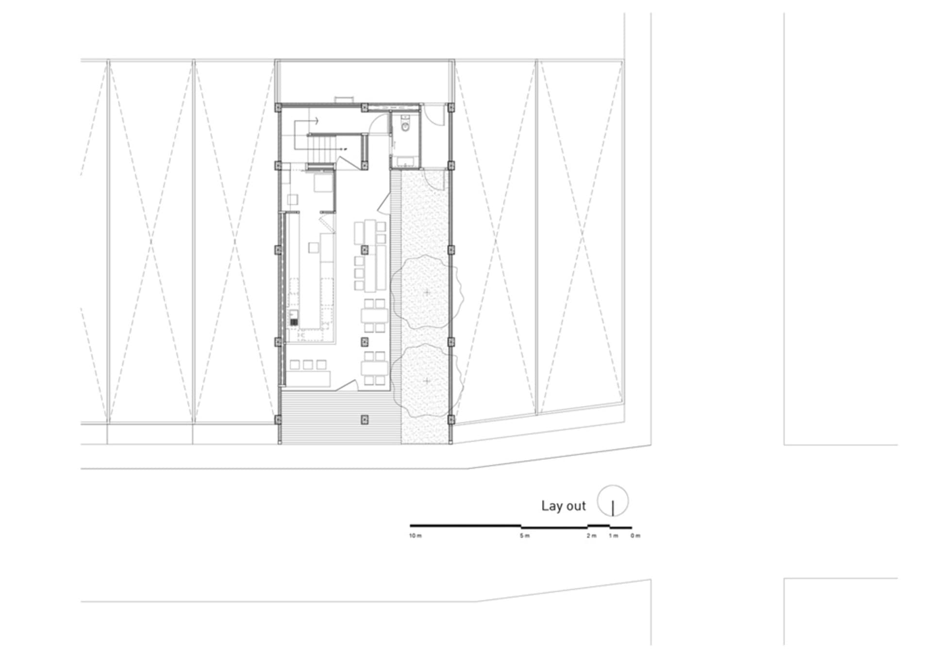 A detailed technical architectural drawing of a modern interior space, featuring various functional zones and layout.