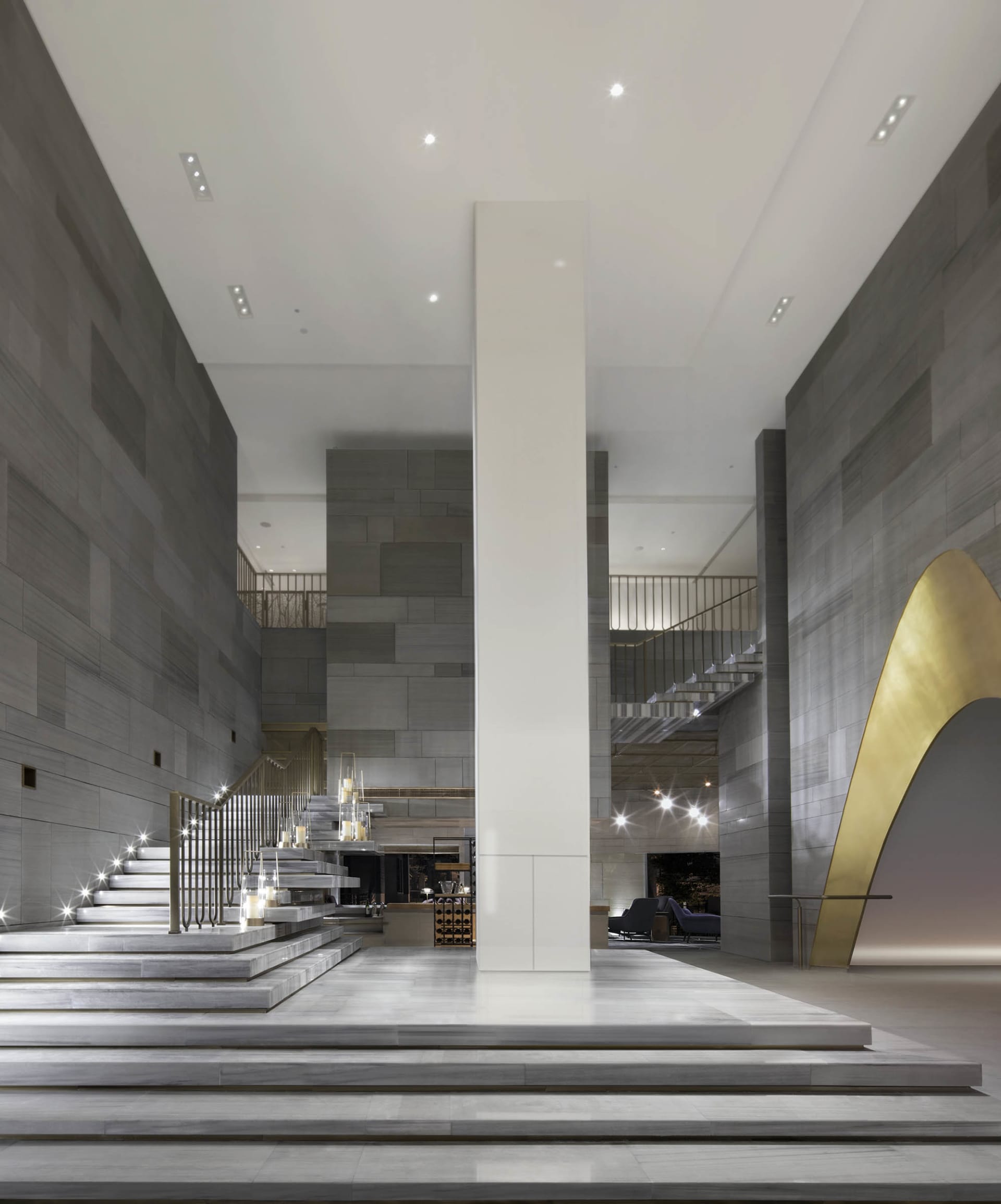 A luxurious modern hotel lobby with marble finishes and sophisticated design elements.