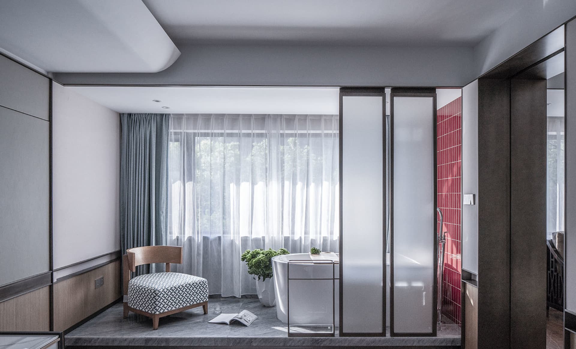 A minimalist bathroom featuring glass walls and marble finishes.