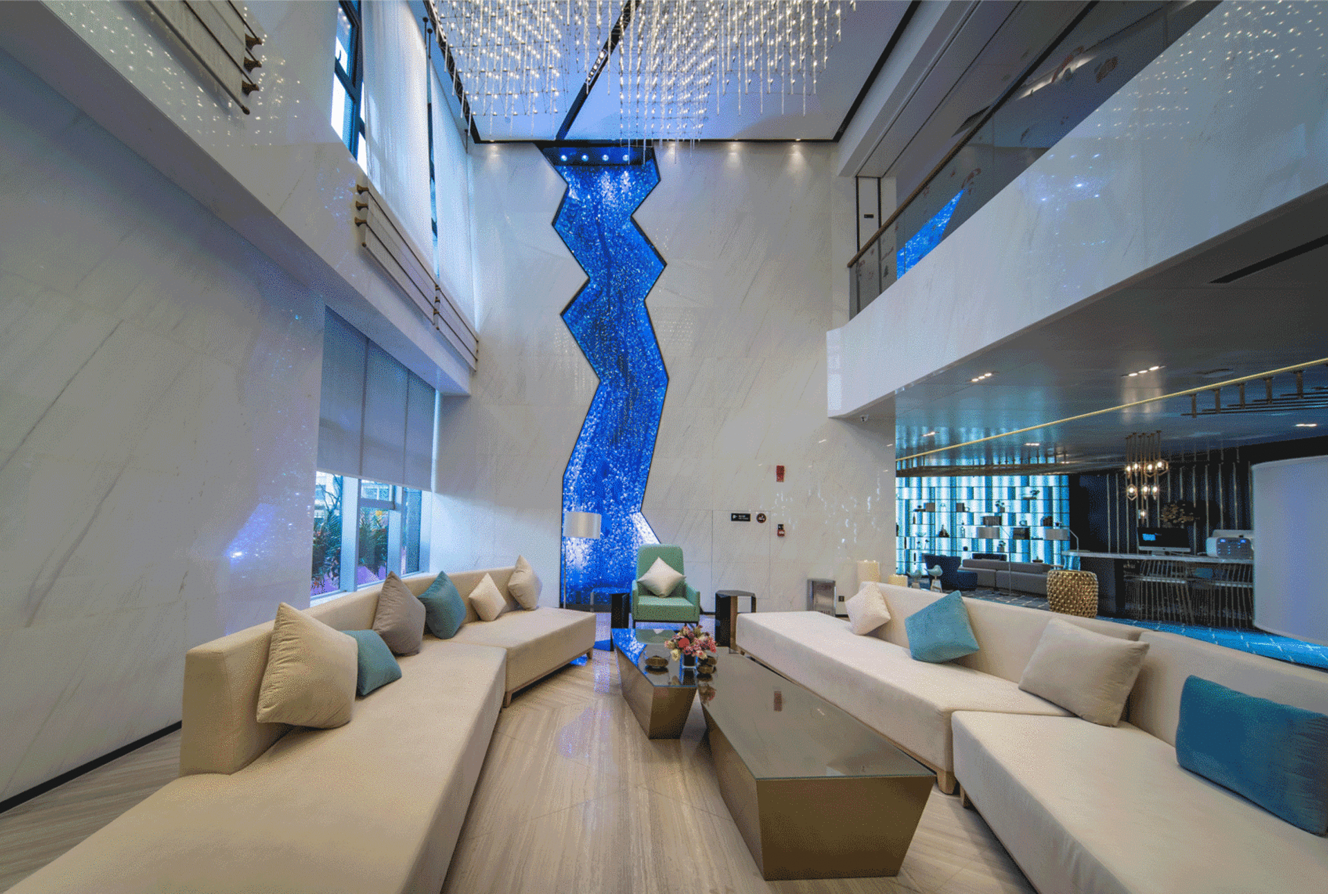 Modern hotel lobby with glass wall and high ceilings