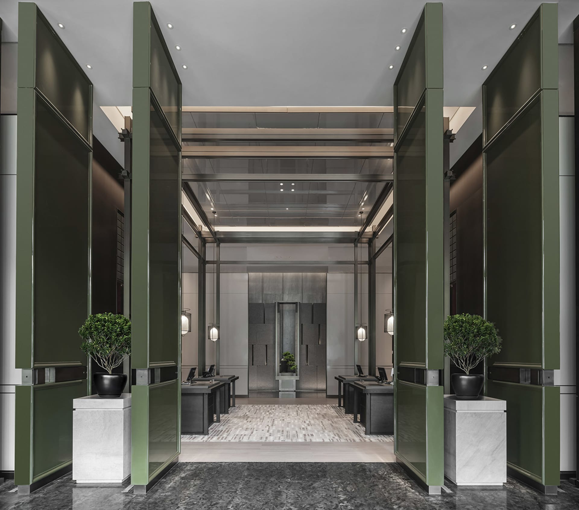 Modern office entrance featuring metal panels and glass