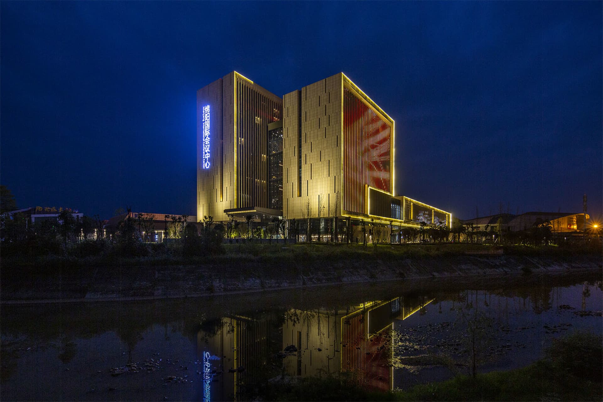 A modern conference center with glass and steel exterior.