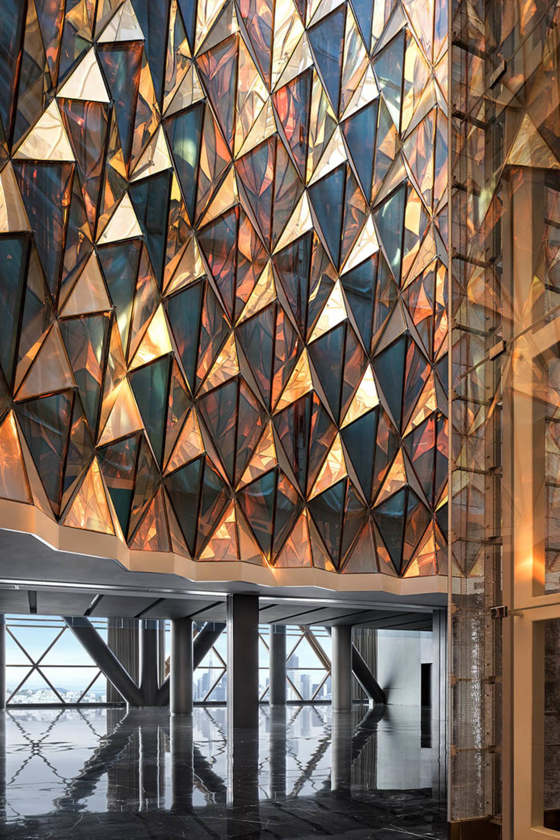 A modern interior design featuring a wall adorned with a pattern of glass prisms.