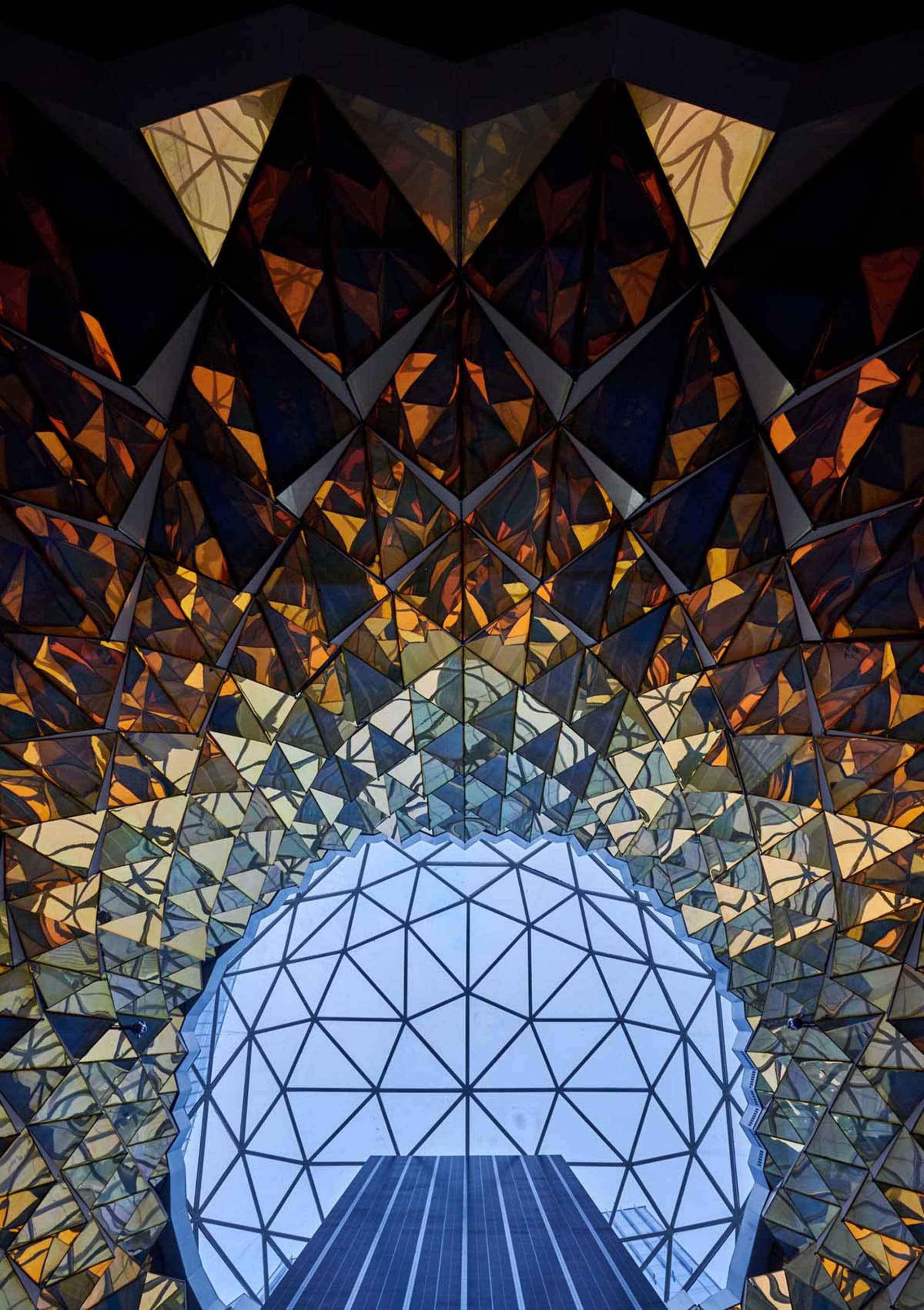 A modern interior design featuring glass and metallic elements
