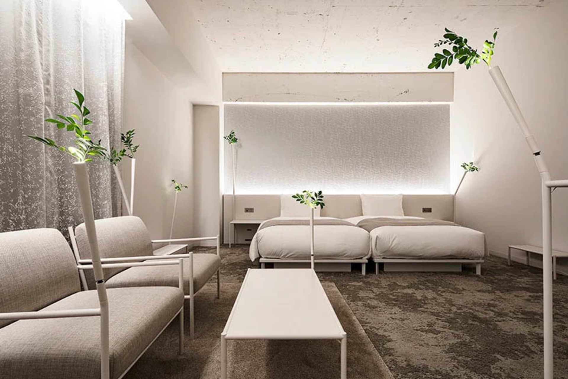 A modern minimalist living room featuring sleek furniture, contemporary decor, and sophisticated technology.