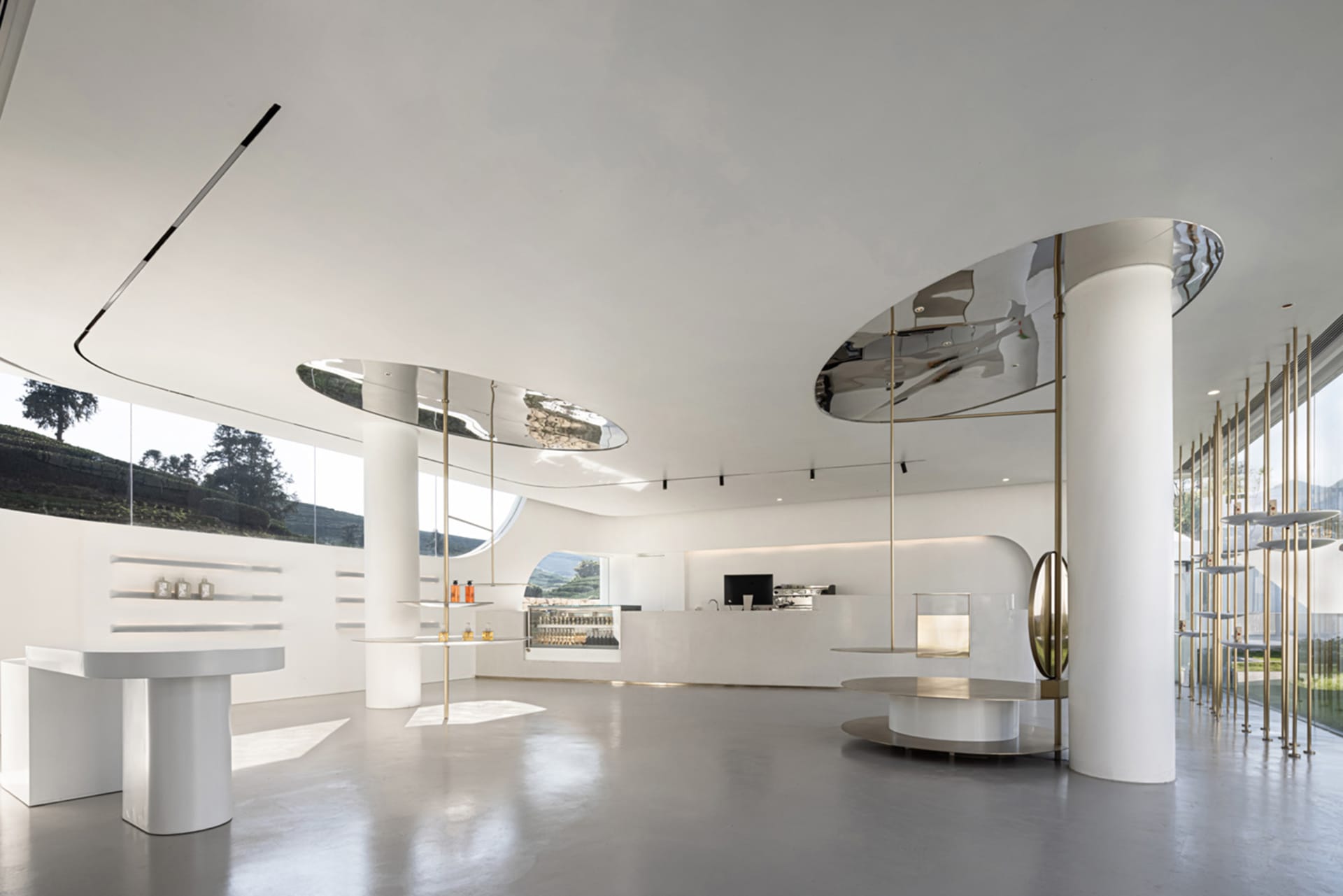 Modern, white-themed coffee shop with metal accents