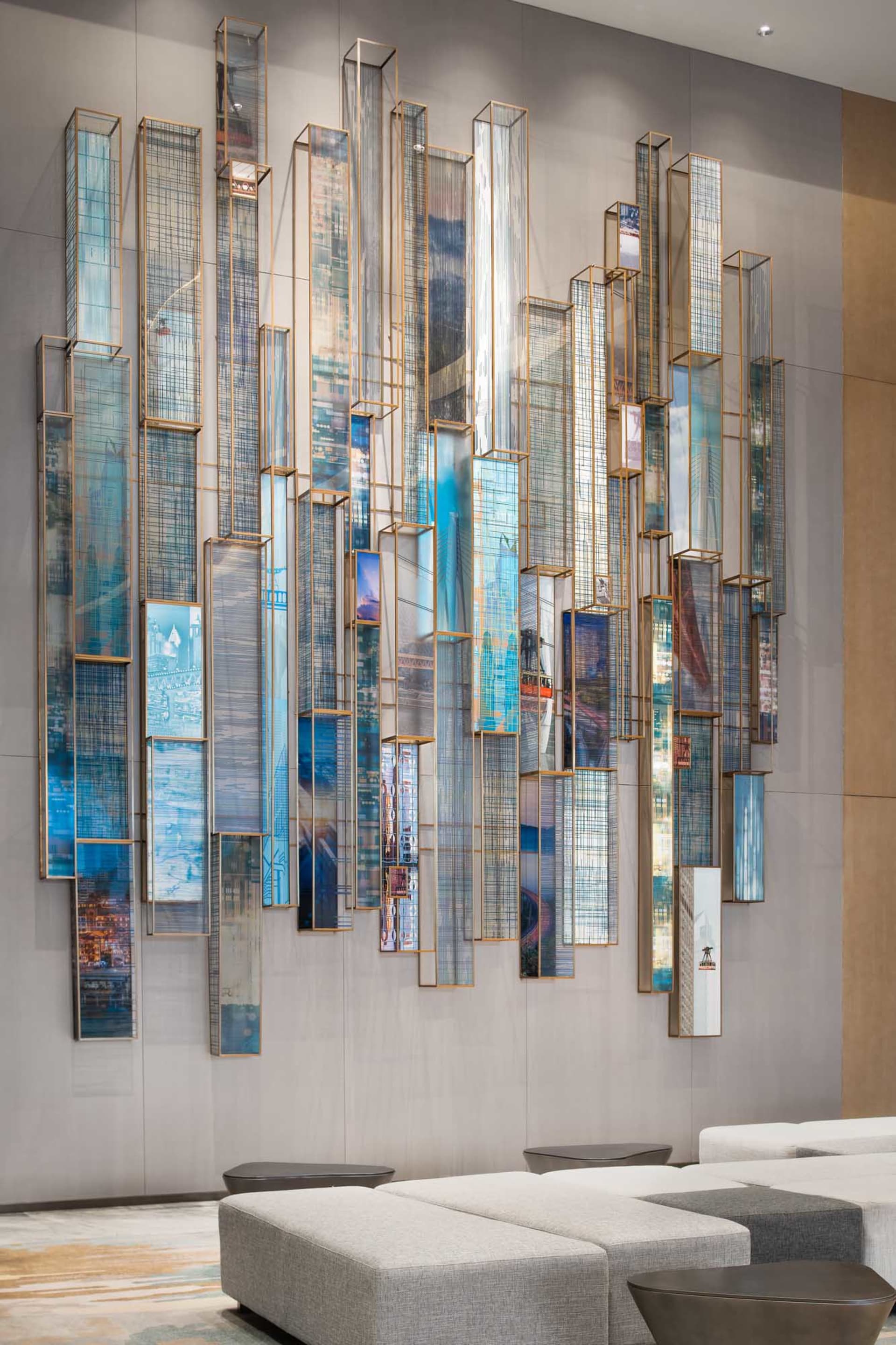 Decorative glass panels arranged vertically on a lobby wall