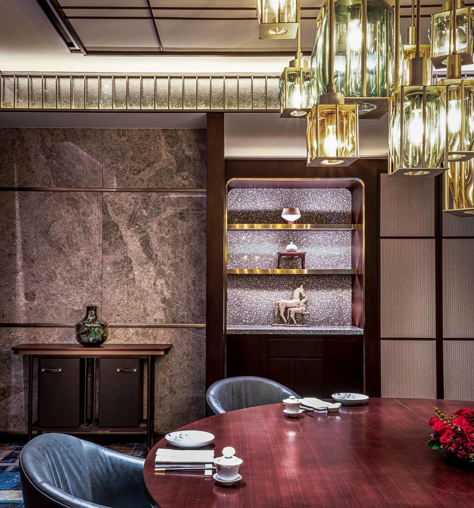 Modern restaurant interior with glass, marble, and wooden elements