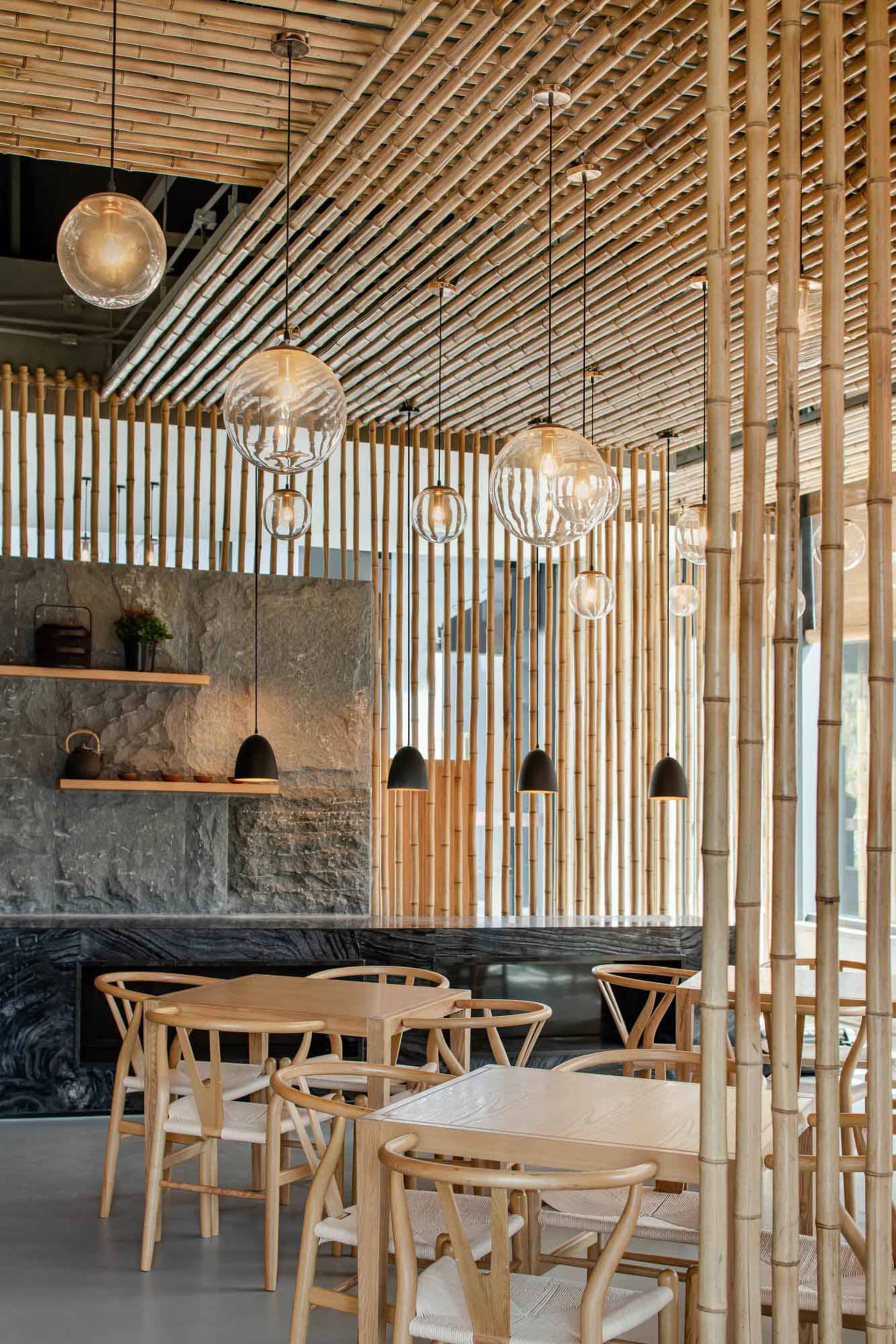 Modern restaurant interior with bamboo ceiling and lighting fixtures