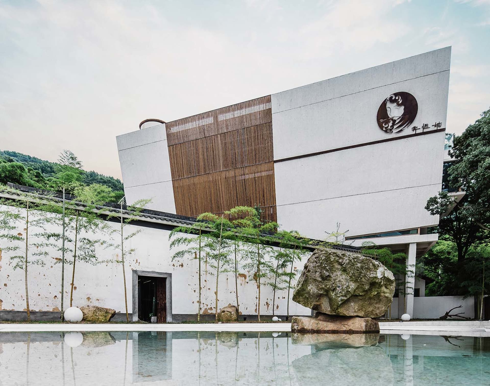 Modern, minimalist exterior of a building constructed with concrete materials.