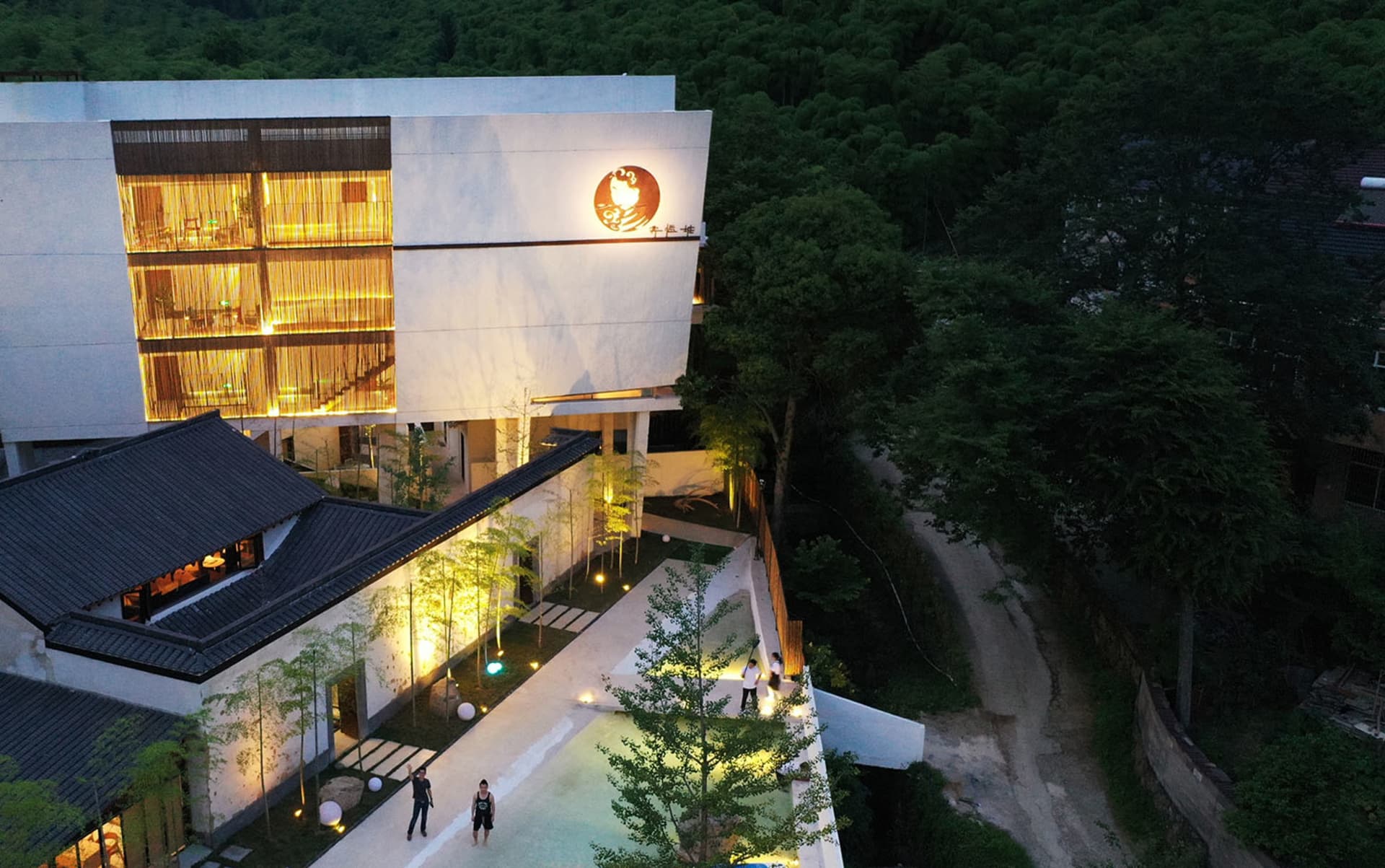 A modern residential community featuring contemporary architecture with concrete and glass materials.