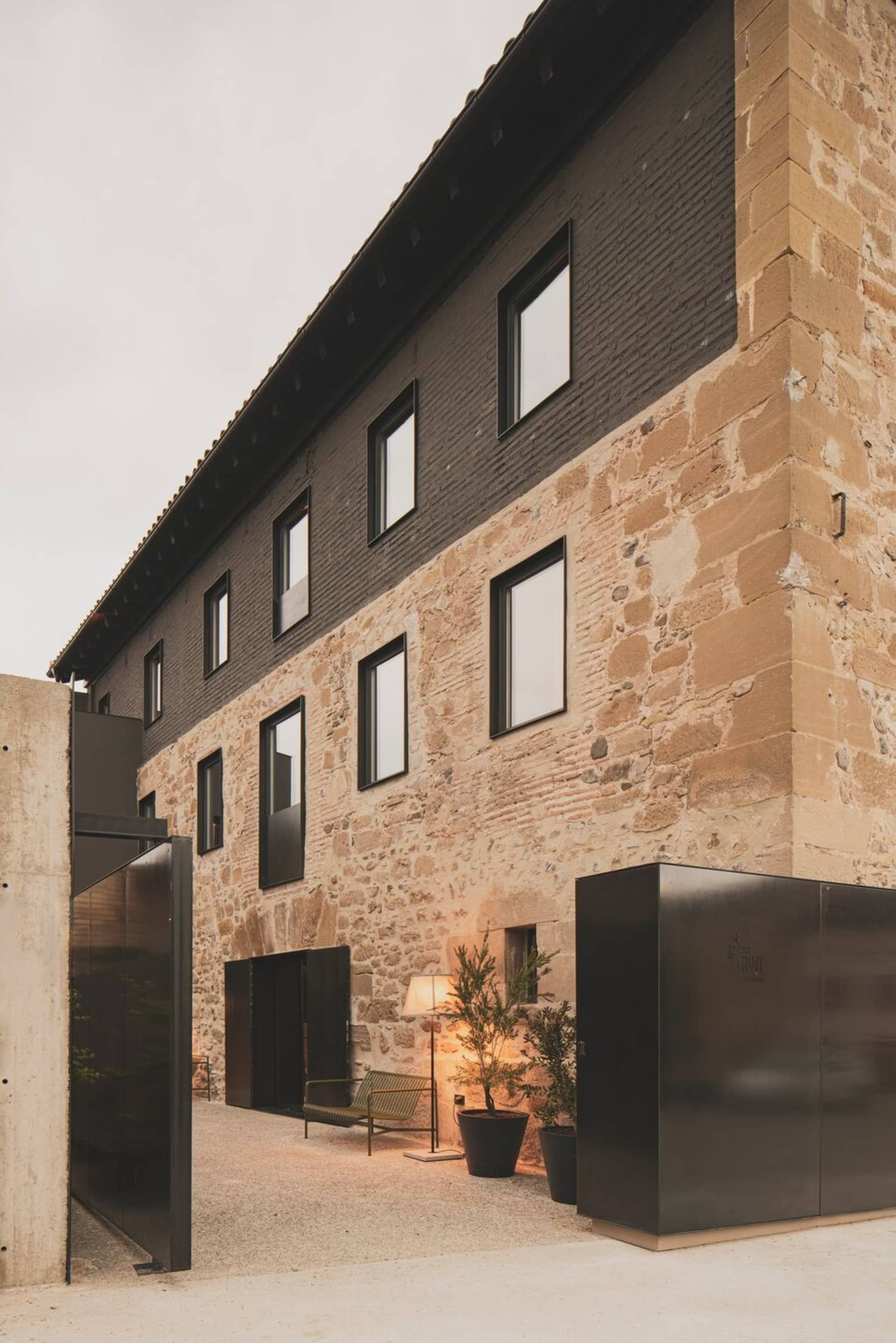 A modern commercial interior featuring brick and concrete materials.