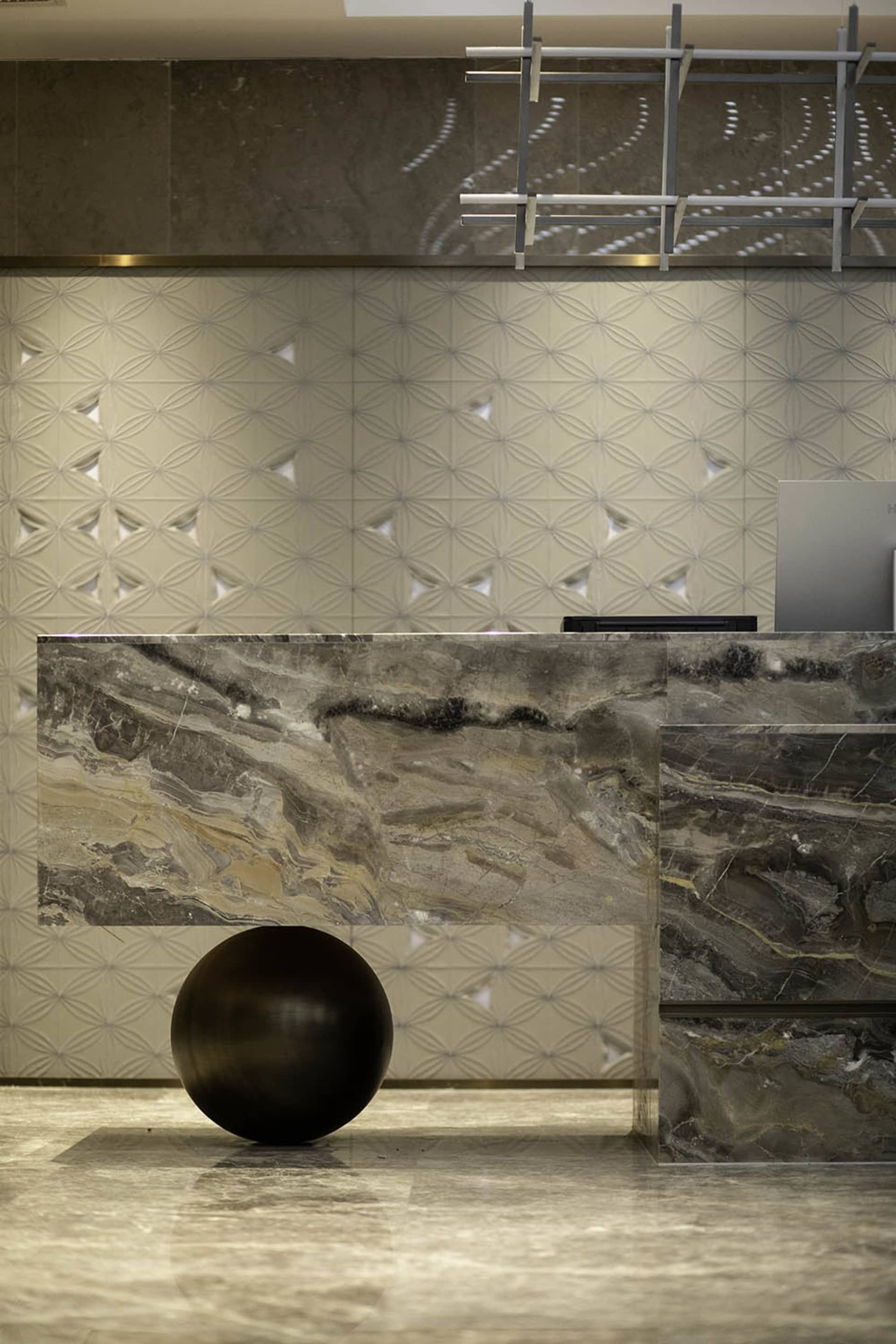 A modern lobby featuring marble elements.