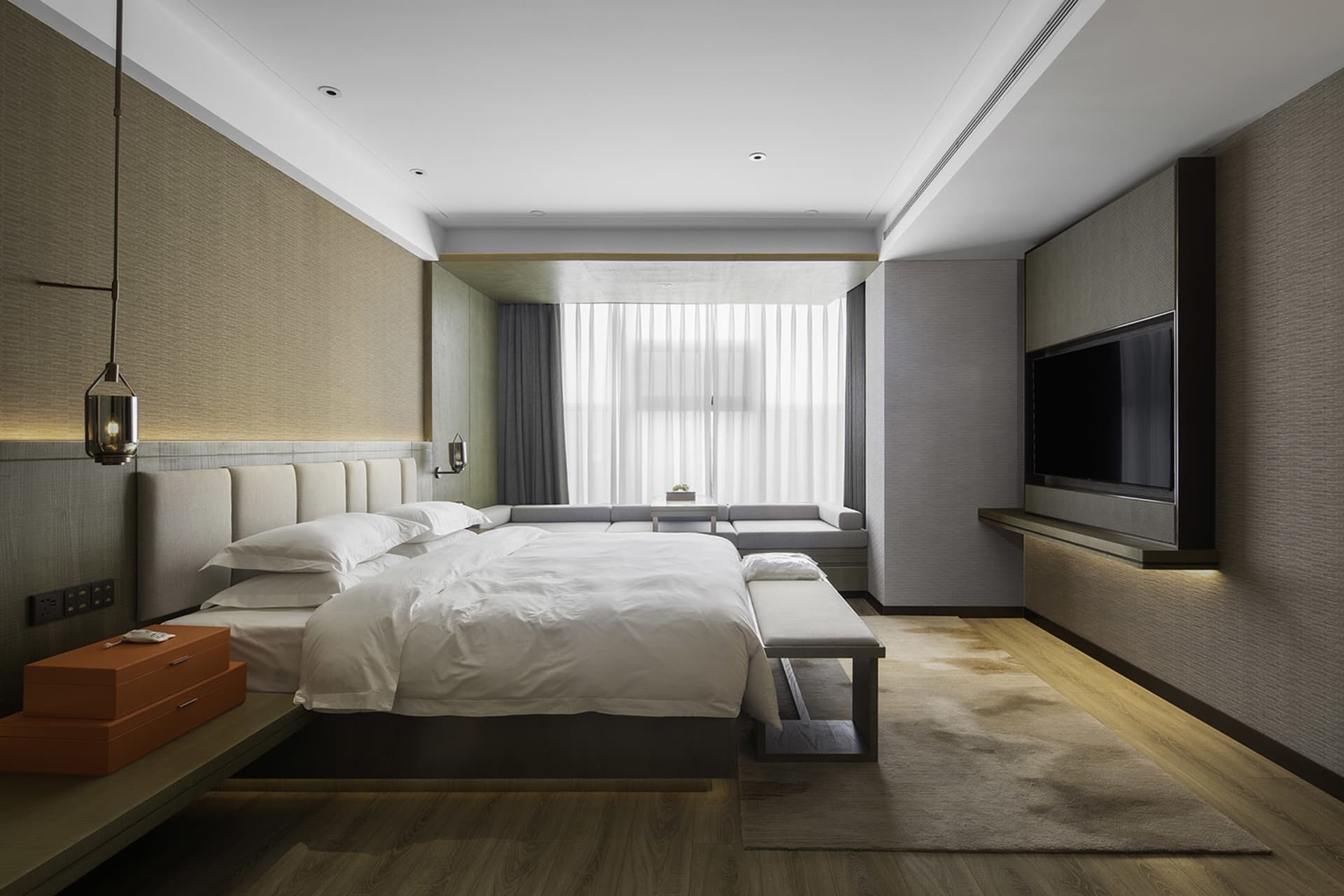 Modern bedroom featuring a neutral-toned color palette