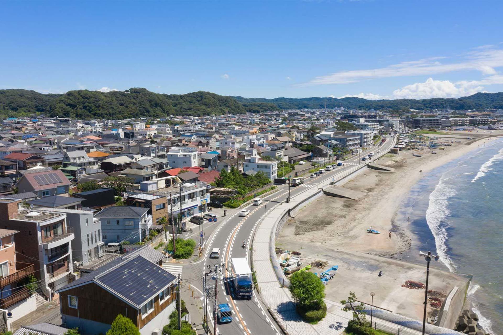 A residential beachside town with concrete buildings and asphalt roads.
