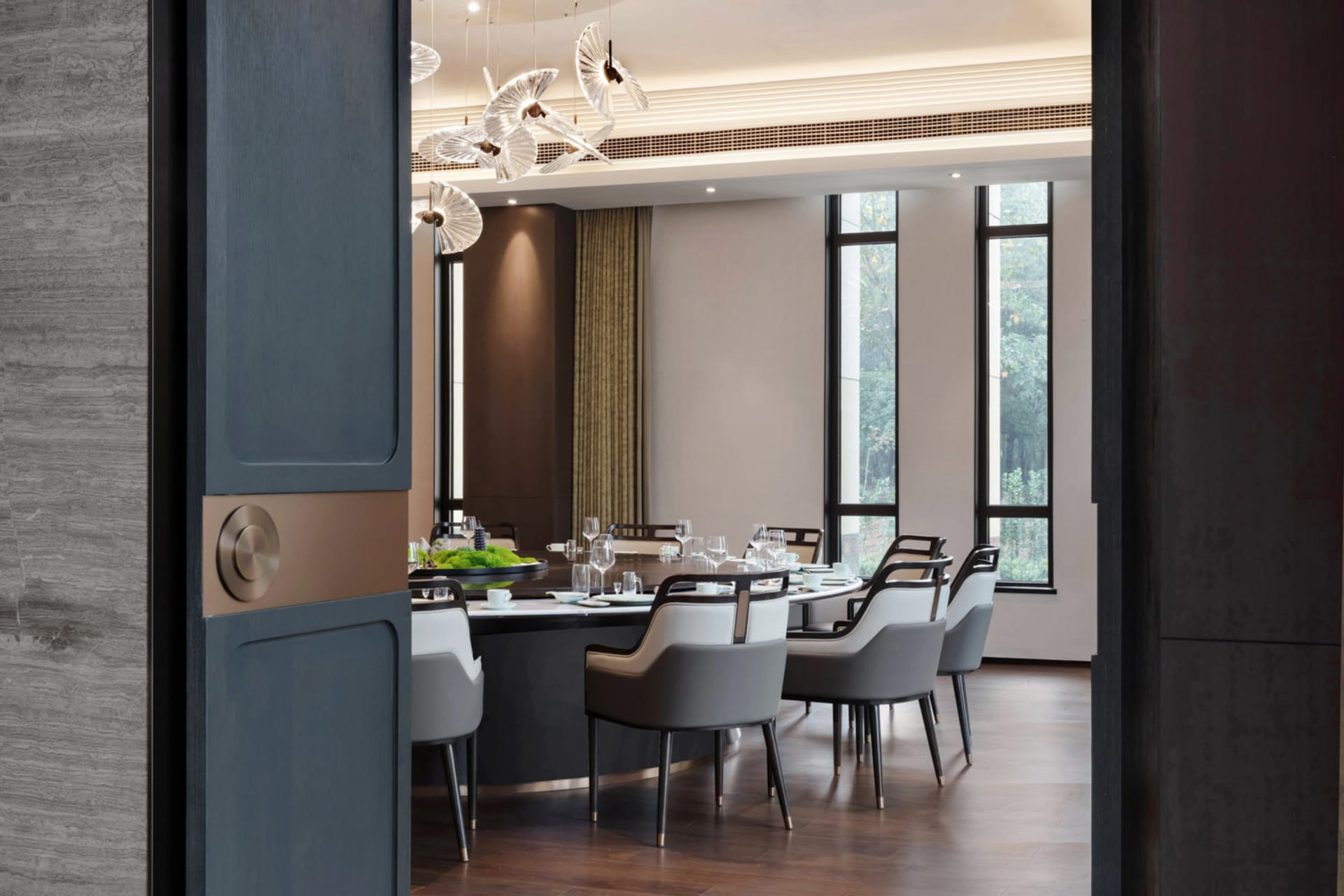 Modern restaurant interior with contemporary furniture and lighting.