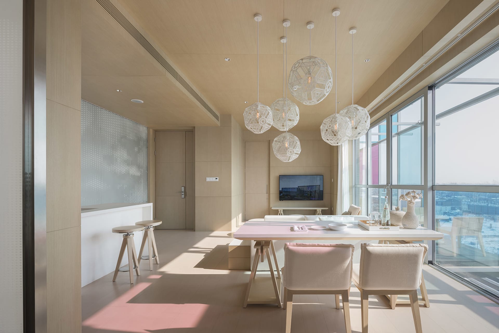 Modern living room featuring a wood and glass interior design.