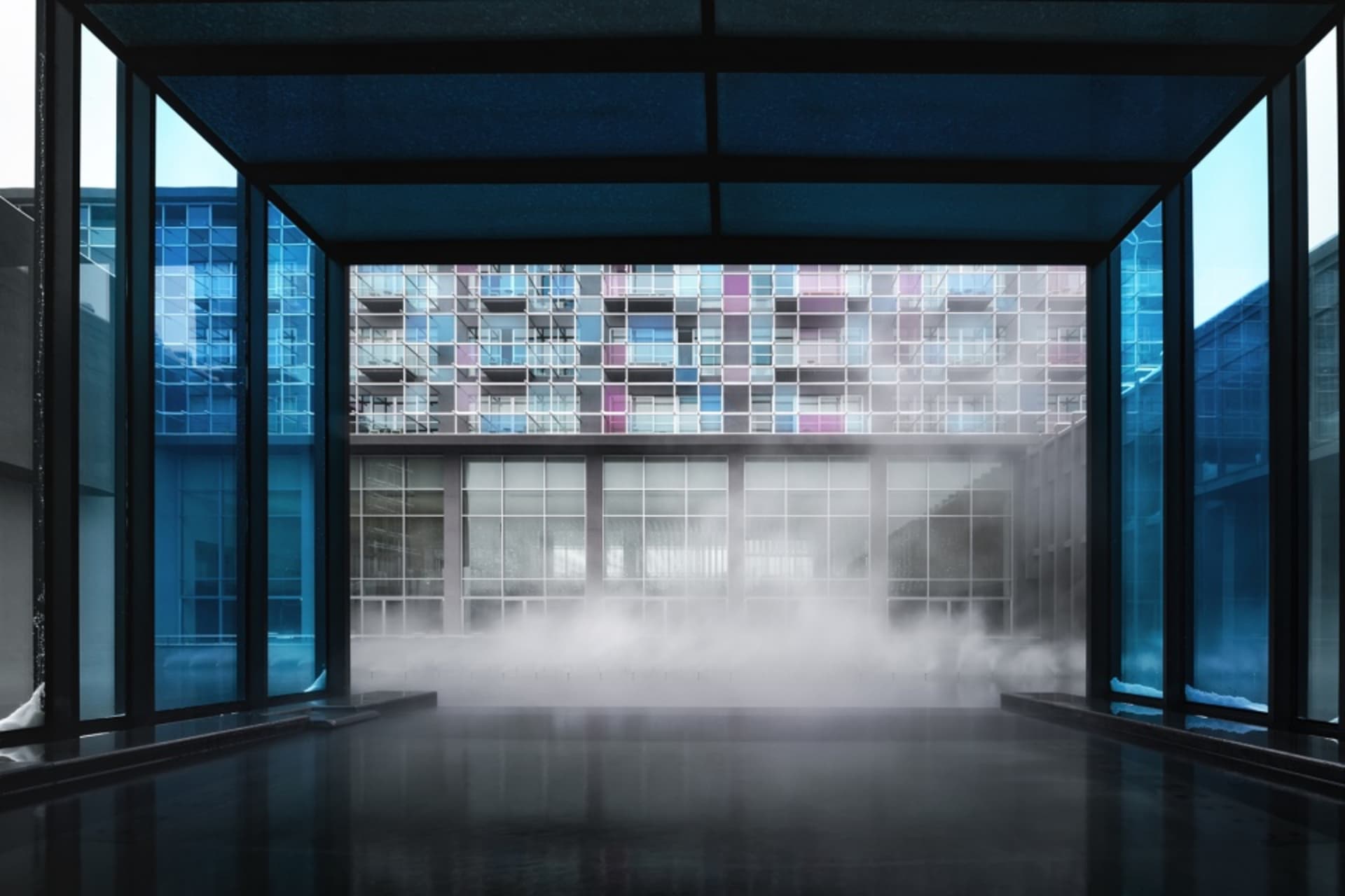 Modern interior design featuring glass walls.