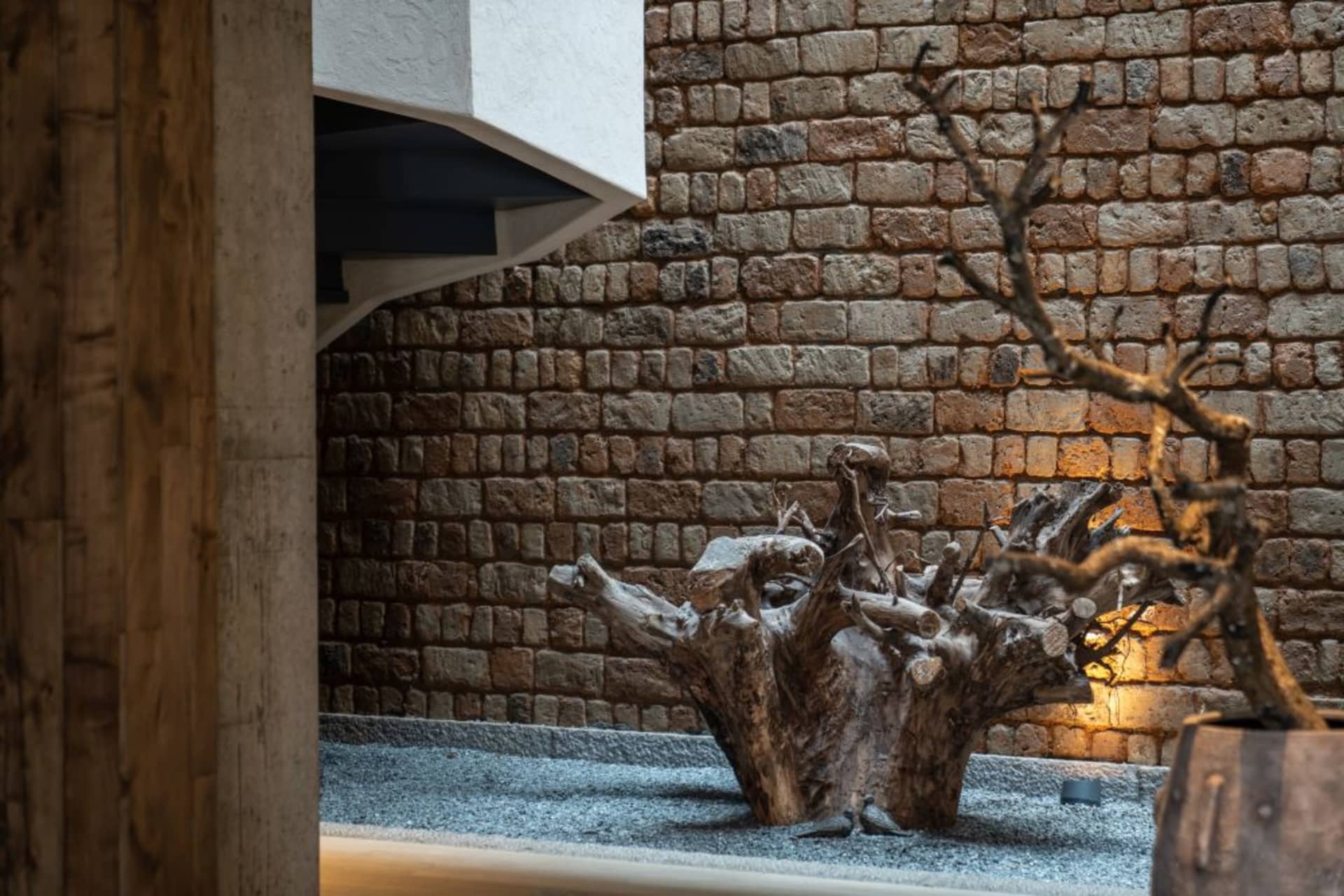 A living space with a stone wall, featuring a textured surface and rustic appeal.