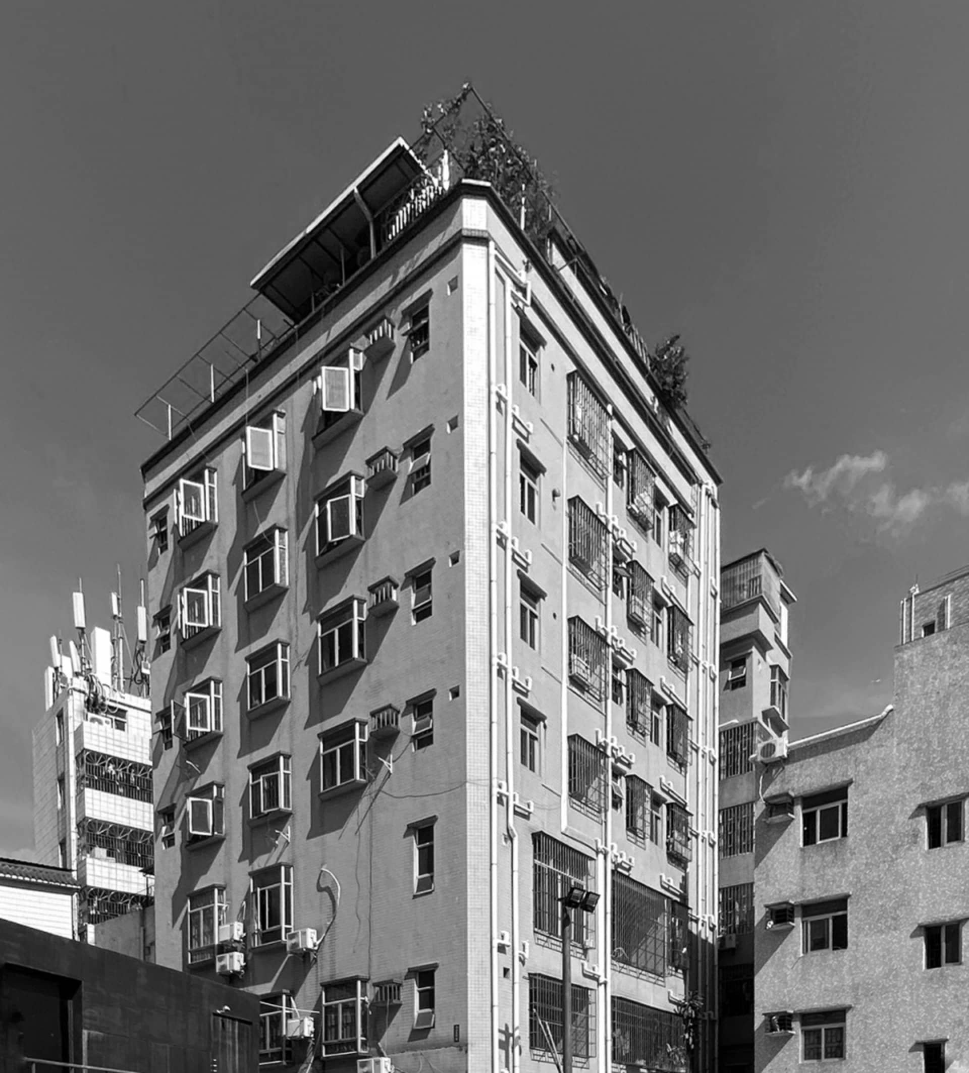 Modern apartment building with a concrete exterior.