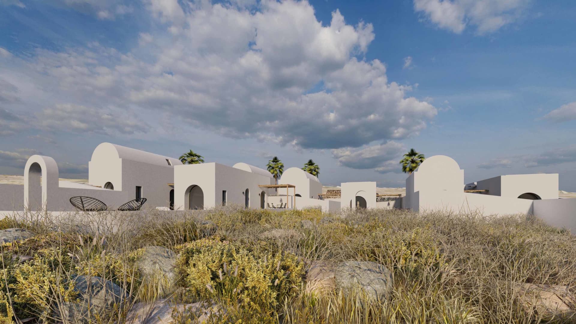 Modern residential houses with white walls and rounded arches, set against a backdrop of clouds and dry vegetation.