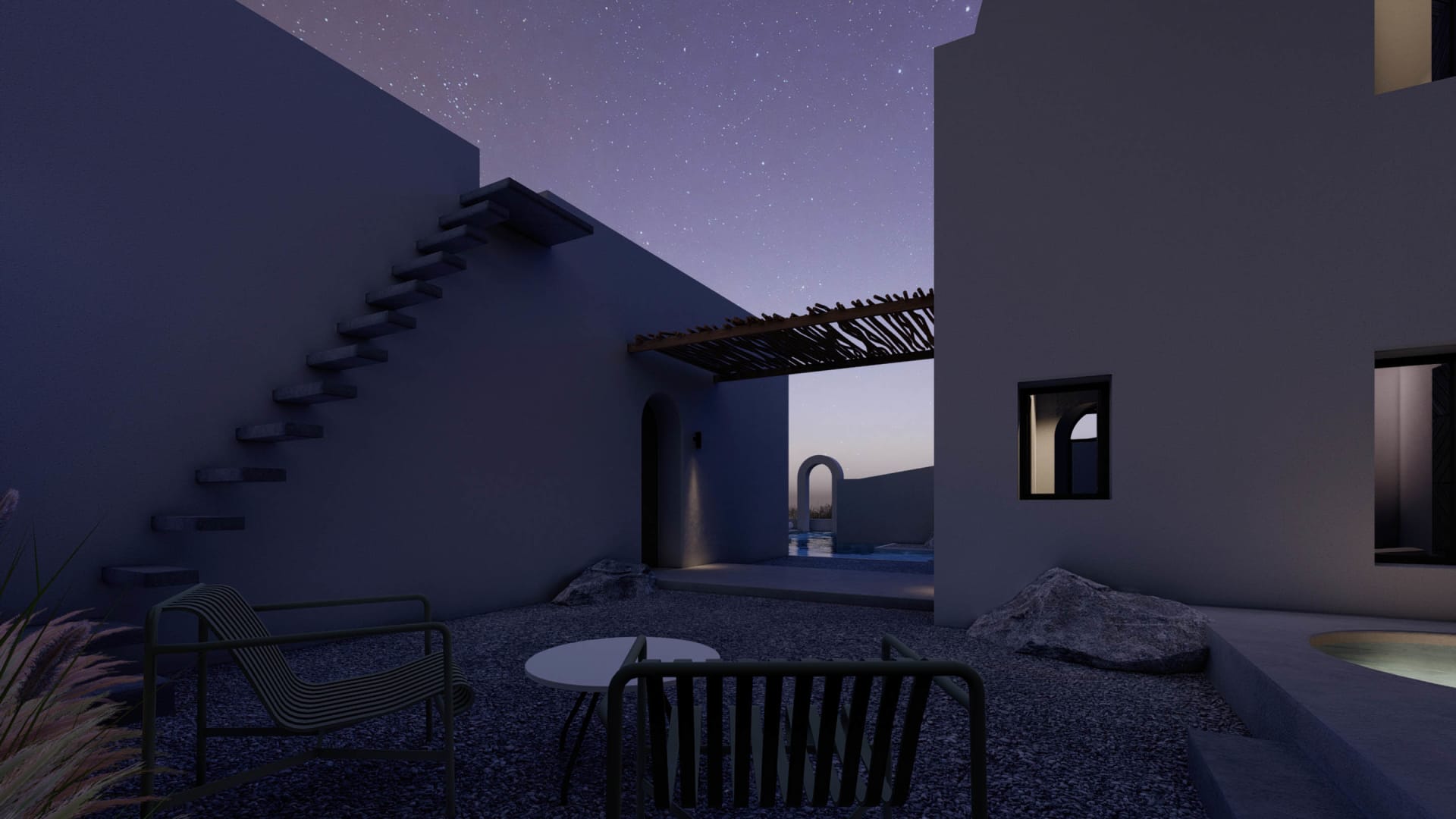 A modern residential exterior featuring concrete and rocks under a starry night sky.